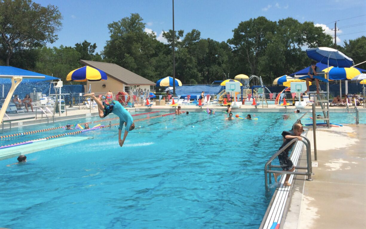 Community pool is located just minutes from Hoverstay northwest Austin properties - lap pool, dive board, beach end swimming area.