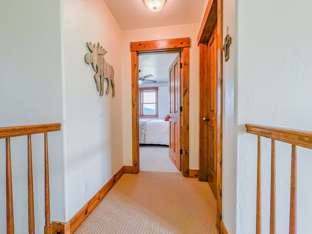 Upstairs queen bedroom & bunk bedroom ahead.