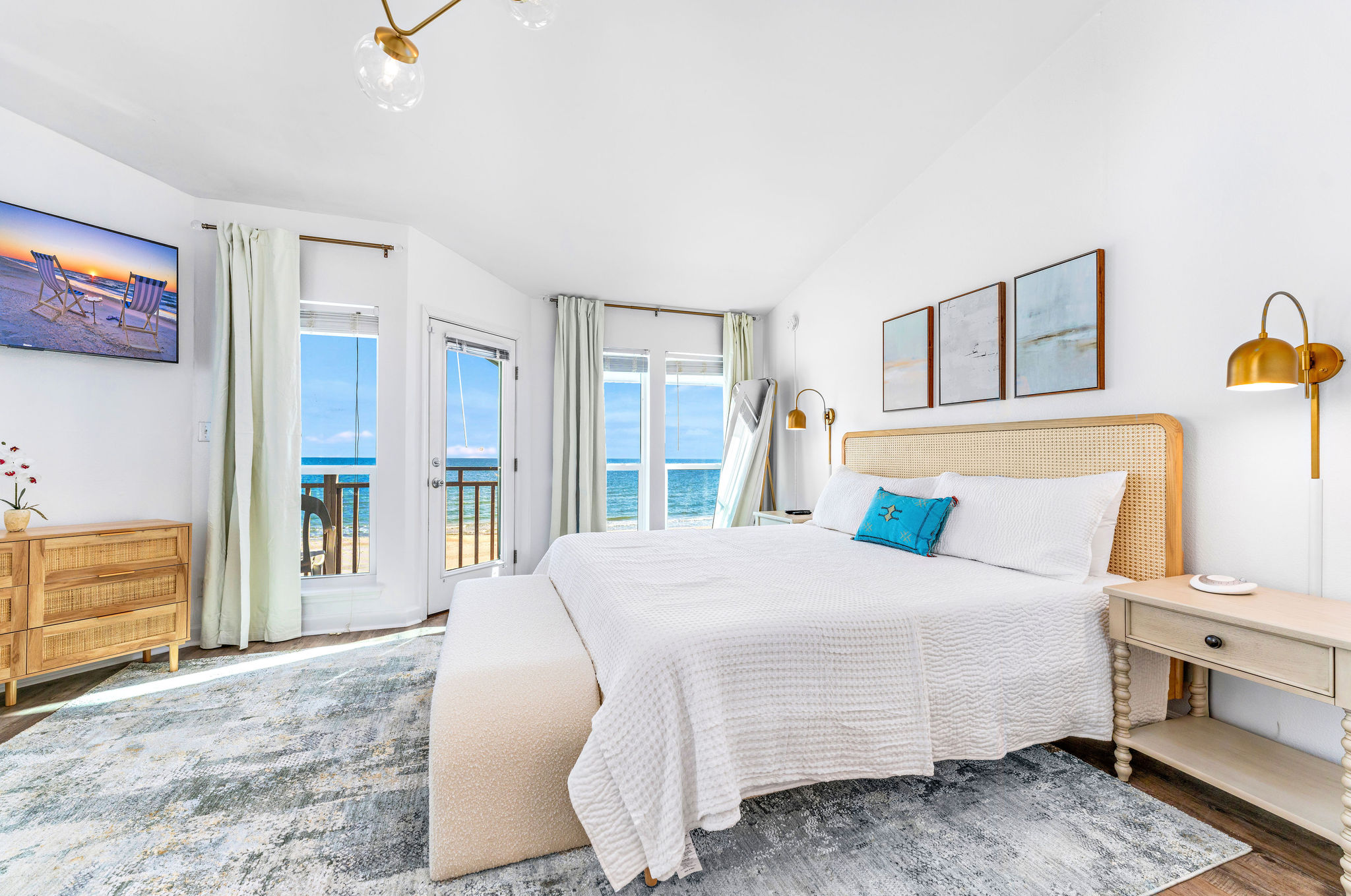 In the master bedroom located on the top level of the house, you can hear the soothing sounds of the waves even with the doors and windows closed, and enjoy watching dolphins swim as you sip your coffee from the bedroom deck.