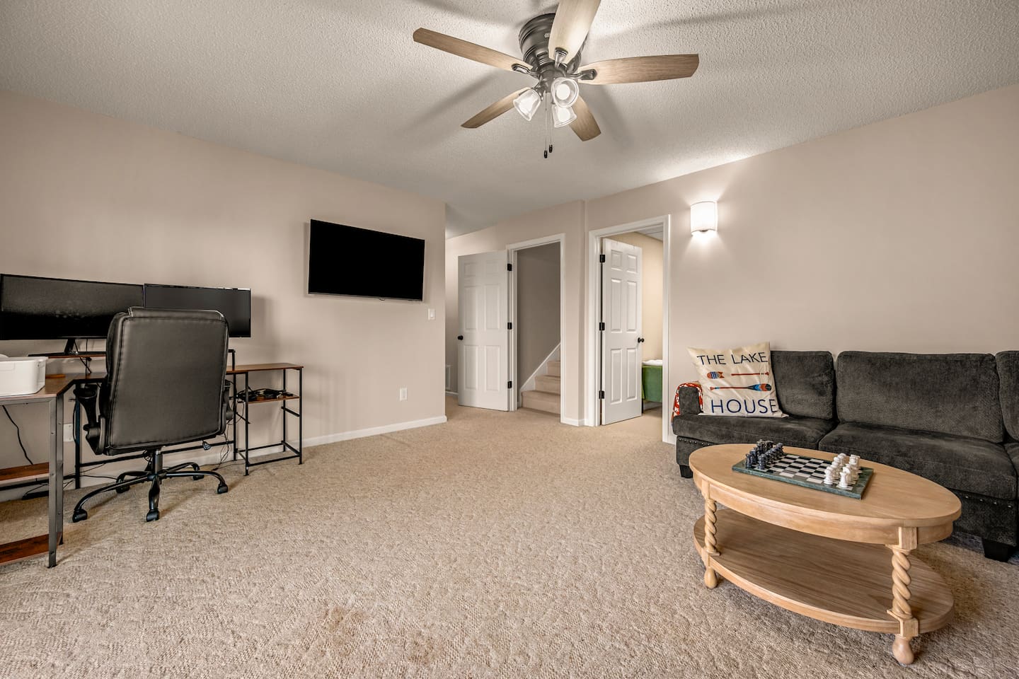 Second living room area: lower level of the home with office space and more