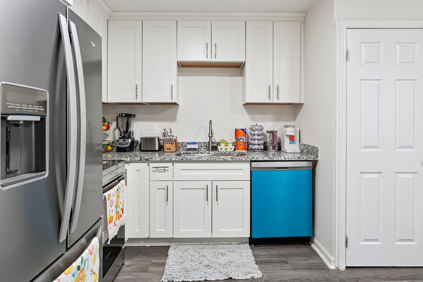 Full kitchen thoughtfully stocked with everything you may need including cookware, utensils, dishes, and essential appliances perfect for preparing meals and enjoying a true home-away-from-home experience.