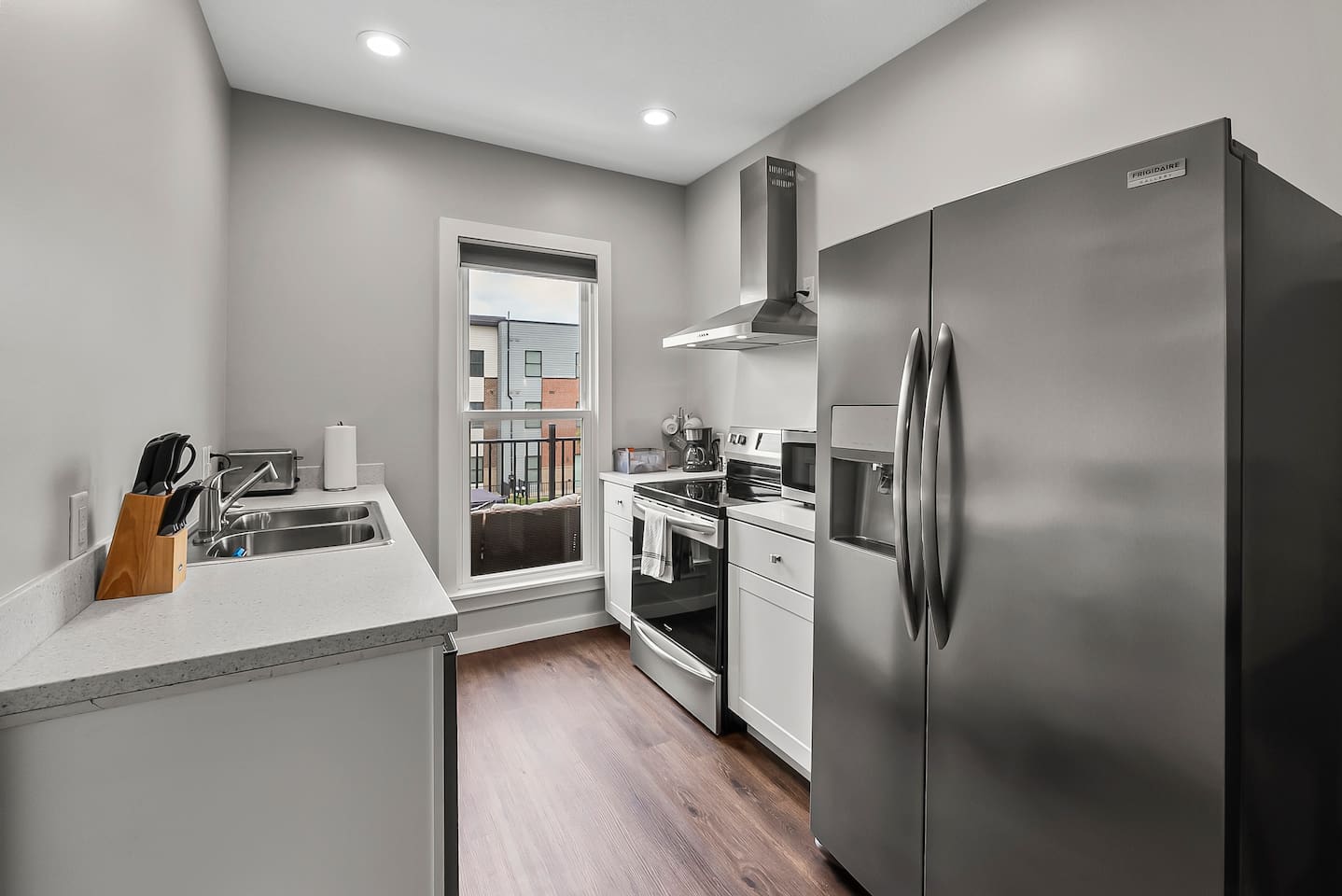 Bright and modern kitchen featuring stainless steel appliances, sleek countertops, and plenty of storage space.