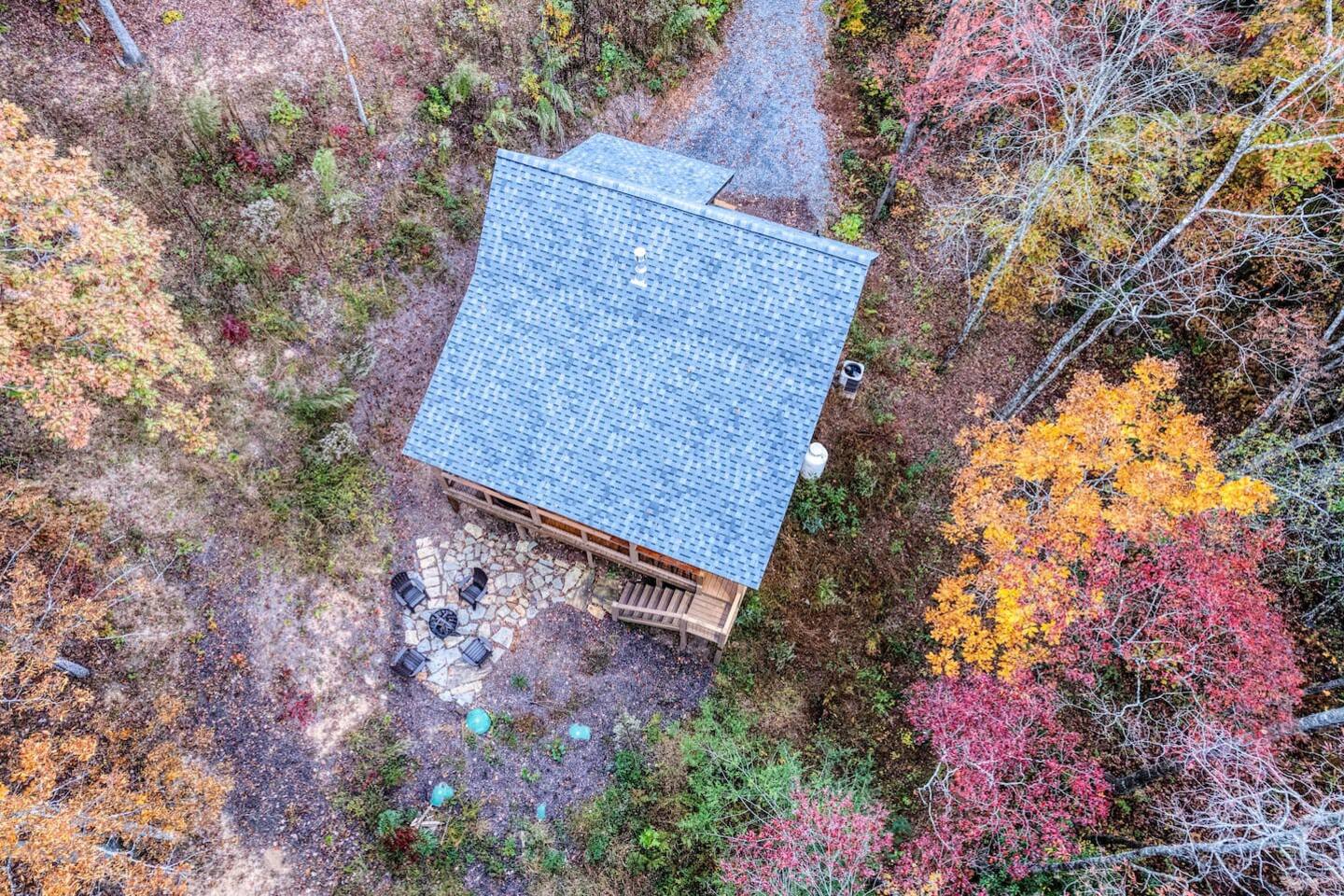Embracing nature's embrace from above - the tranquil haven of our cabin, nestled amidst the wilderness.