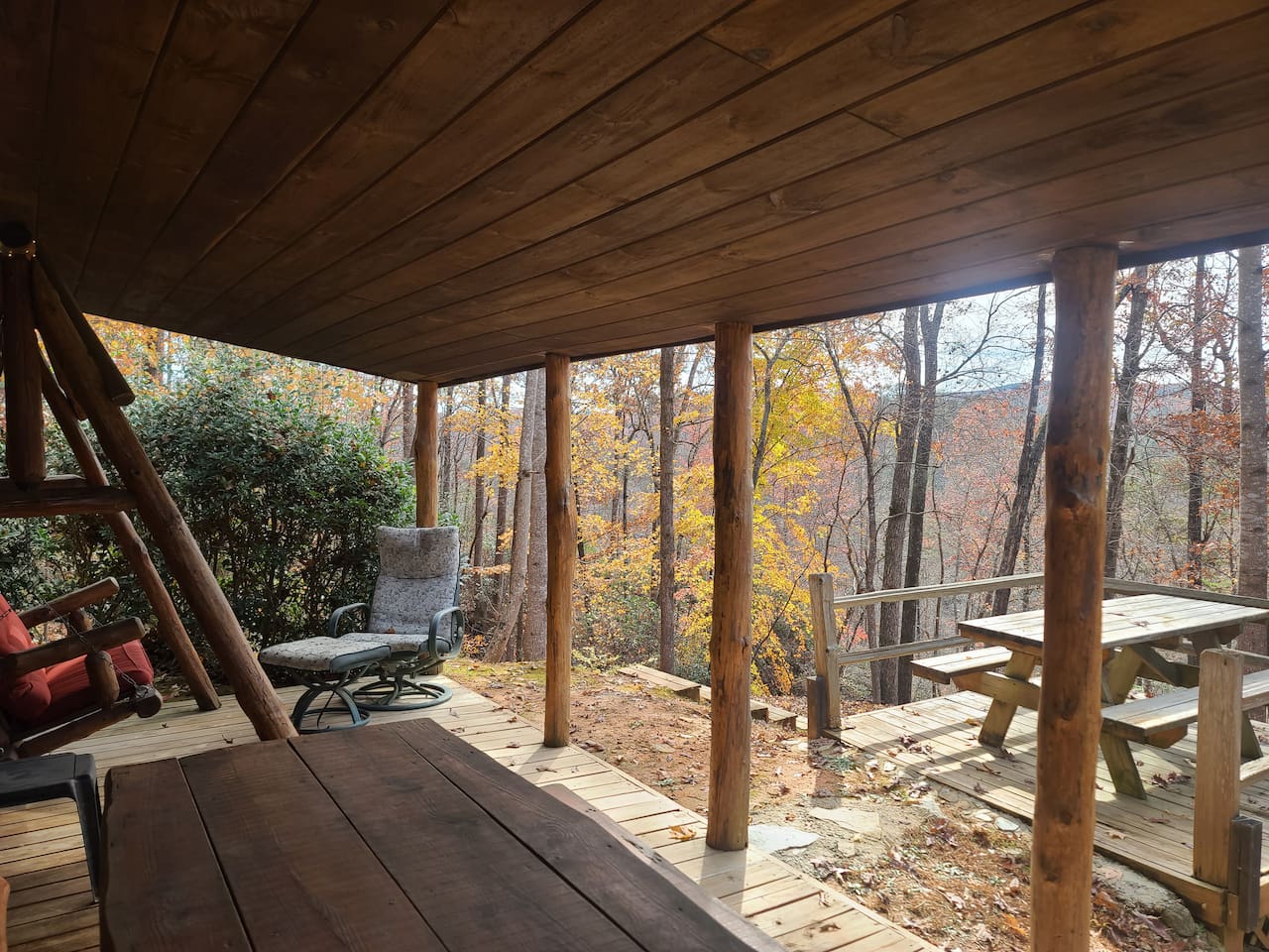 Lower level with 2 picnic tables. Hear the river - huge mountain/lake views.