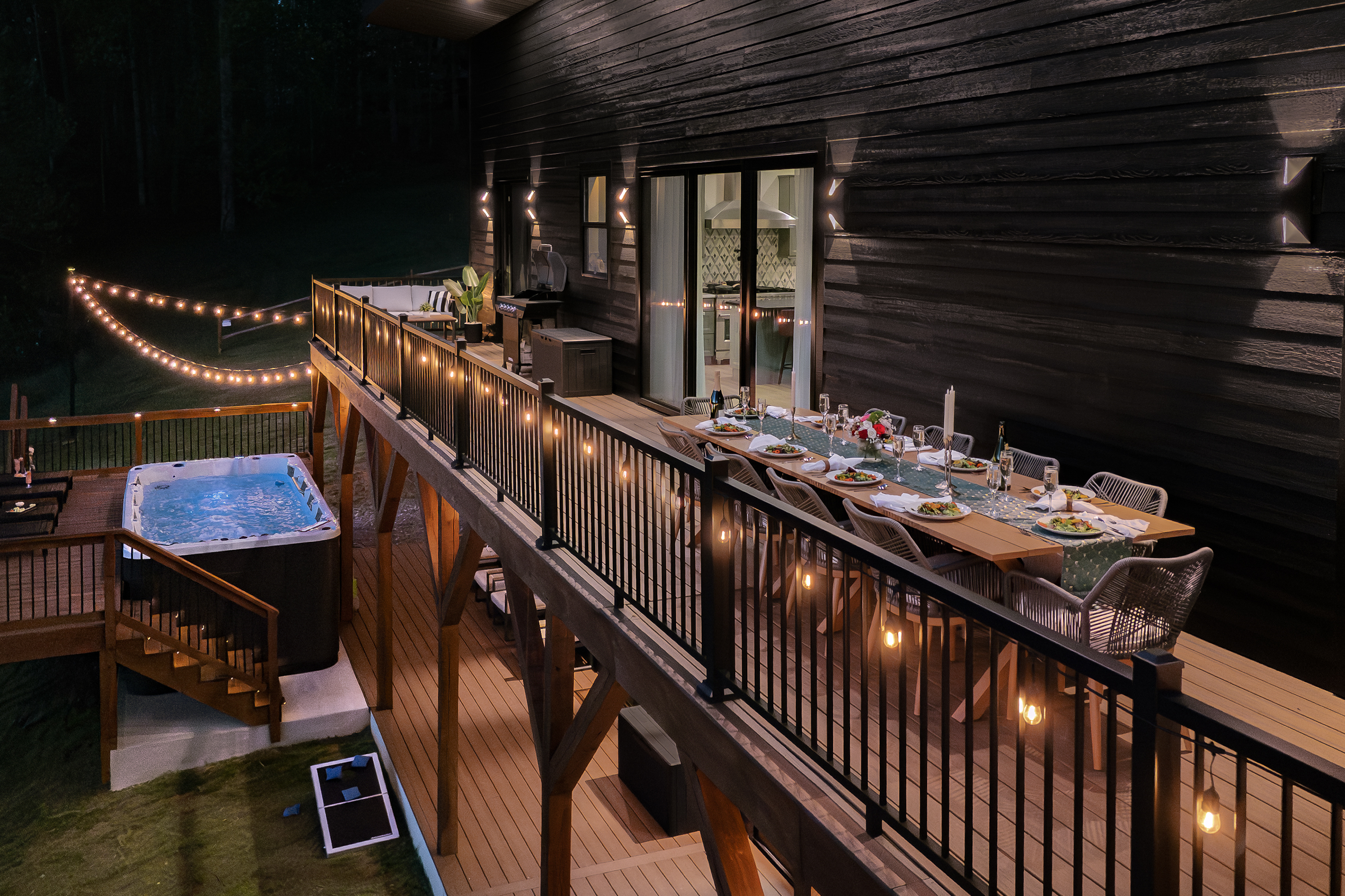 {String-Lit Dining Deck}
As the sun goes down, the deck comes alive with warm string lights, outdoor dining, and unforgettable mountain evenings. Picture dinner under the stars with room for the whole group.
