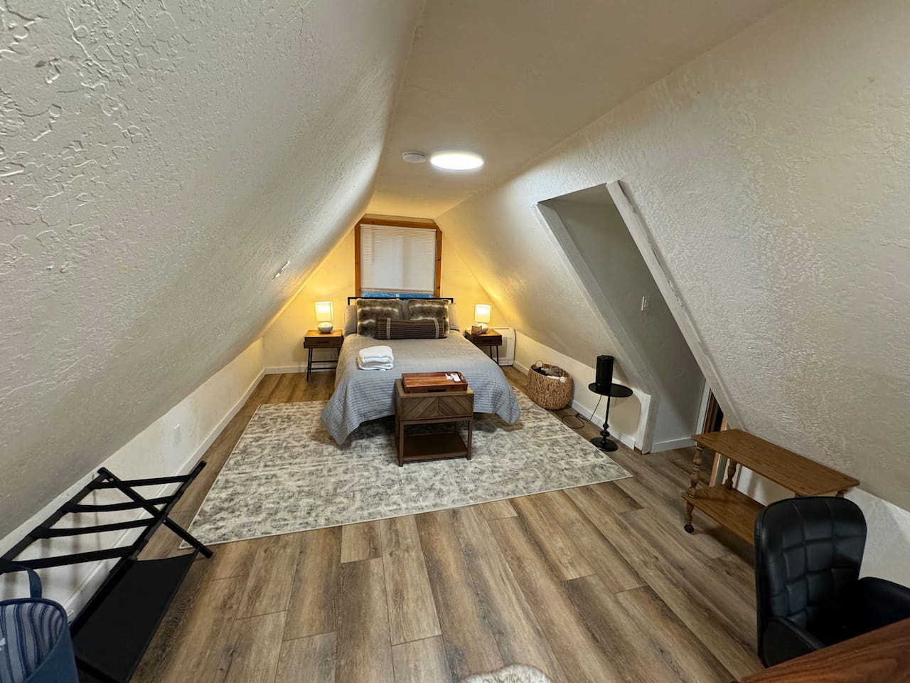 This loft space is just outside the upstairs bedroom and features a comfortable mattress, separate thermostat and extra blankets. 