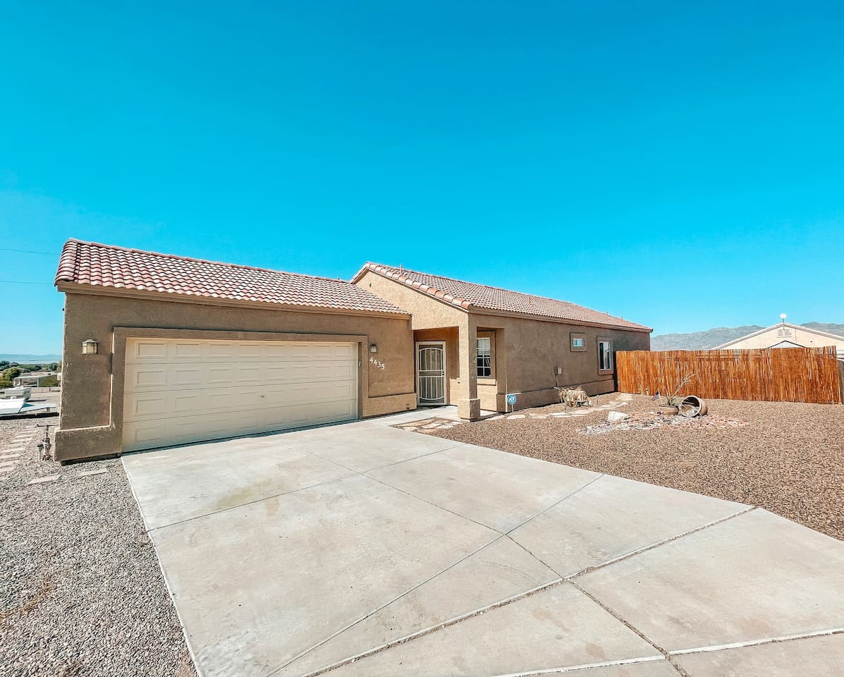 Private driveway with ample parking and attached two-car garage