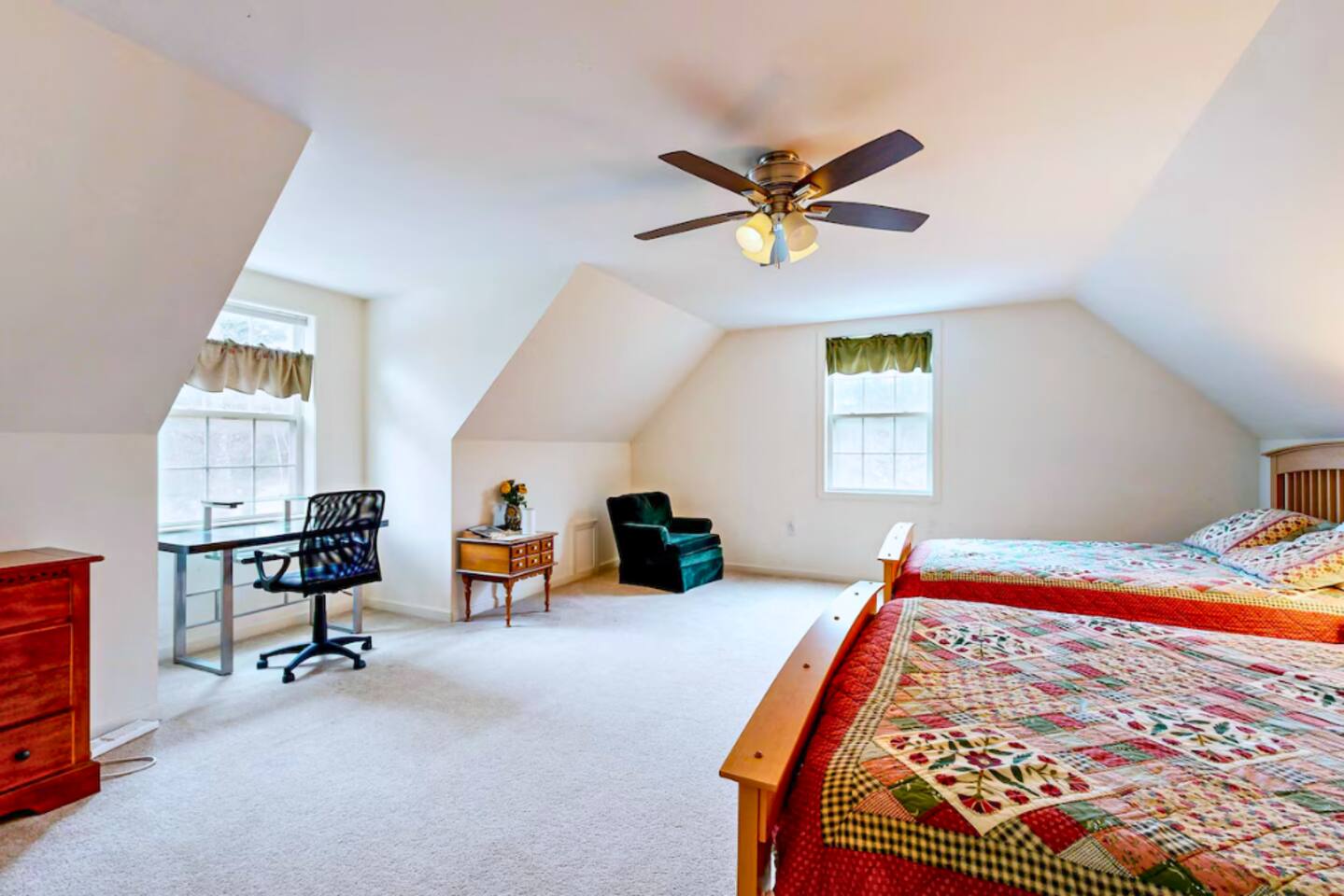 Private office space and reading corner in first bedroom on second floor.