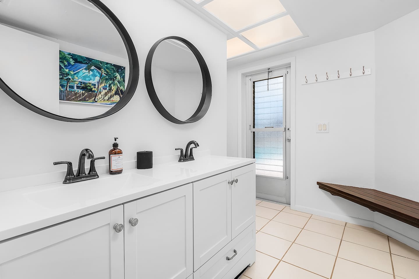Conveniently designed guest bathroom with dual sinks for added comfort and ease!