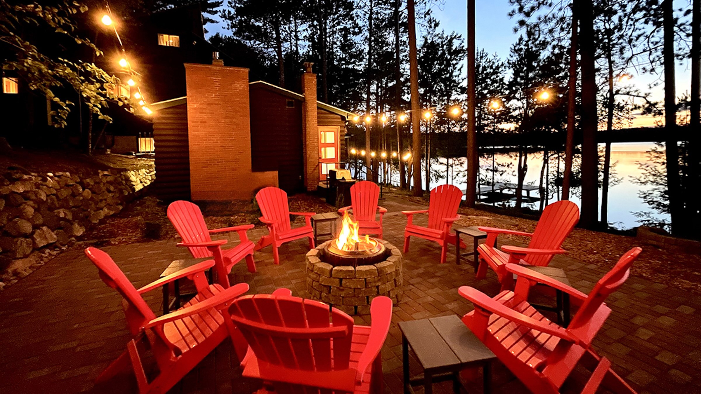 Fire pit patio at night at Dollar Lake Retreat