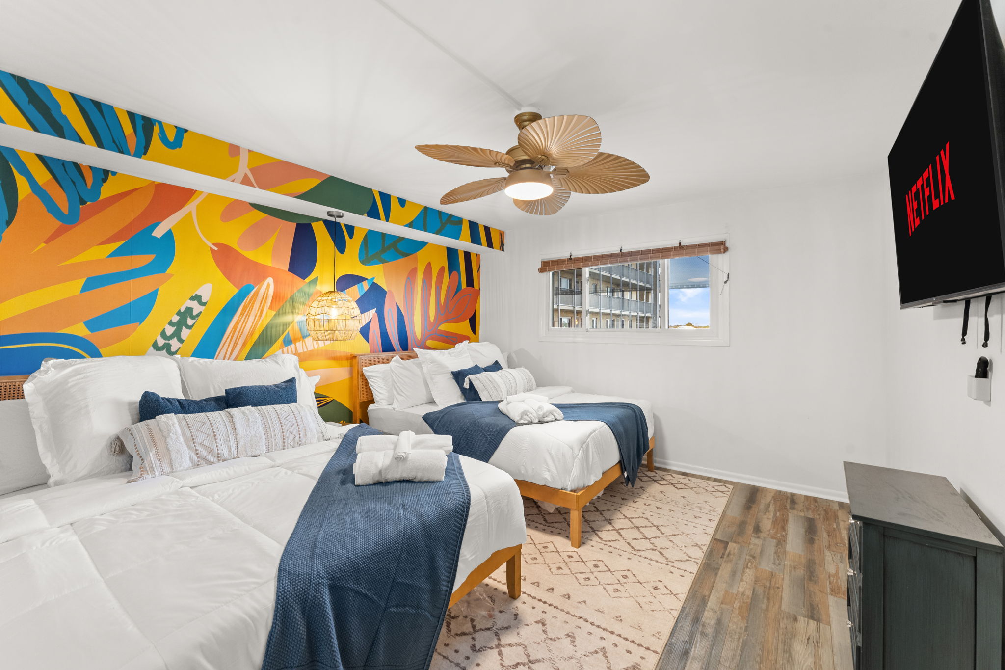 The second bedroom has two queen beds, and a 55inch smart tv