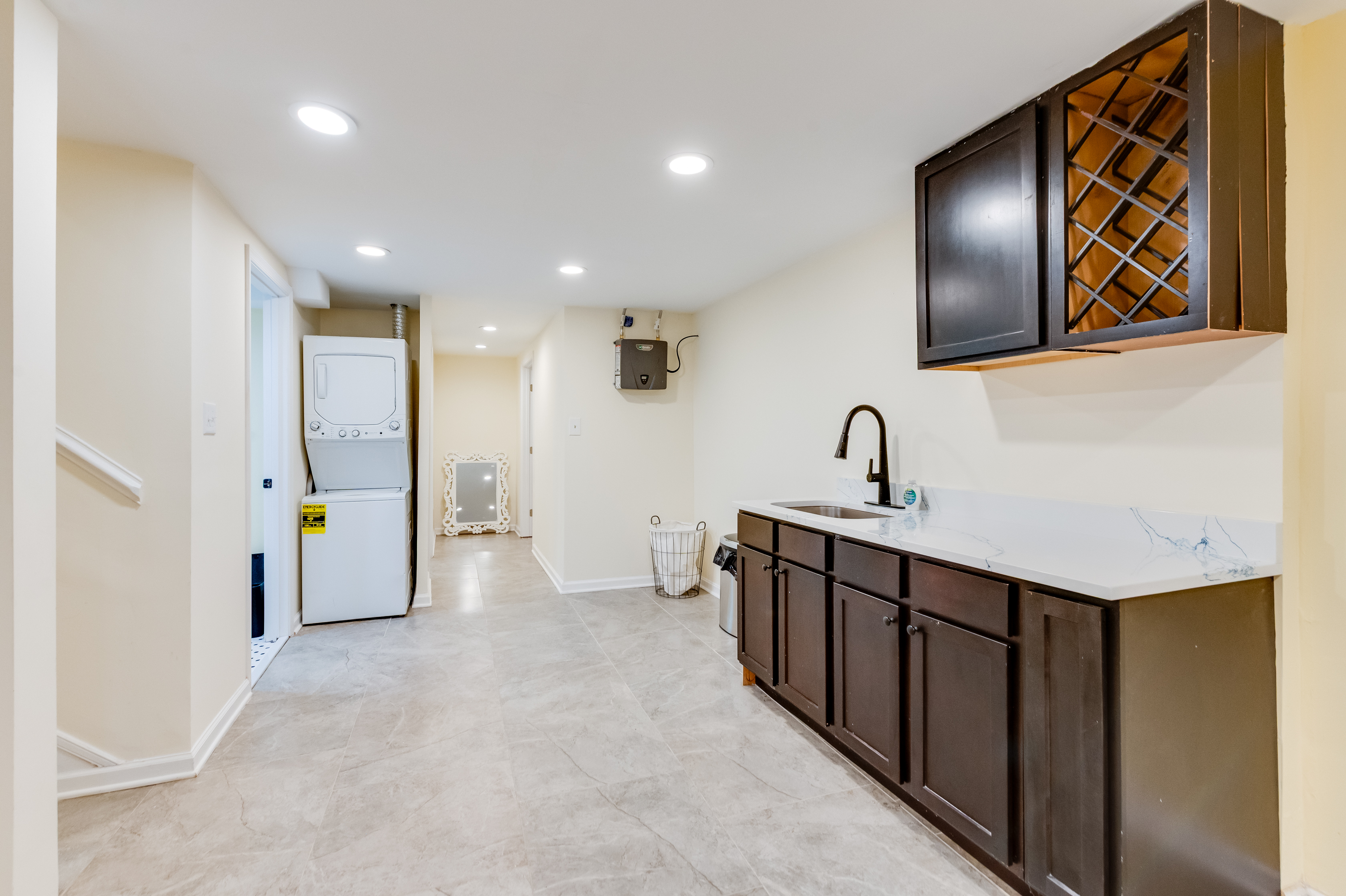 Laundry Area: Enjoy a modern space with sleek cabinetry and convenient appliances at your fingertips!