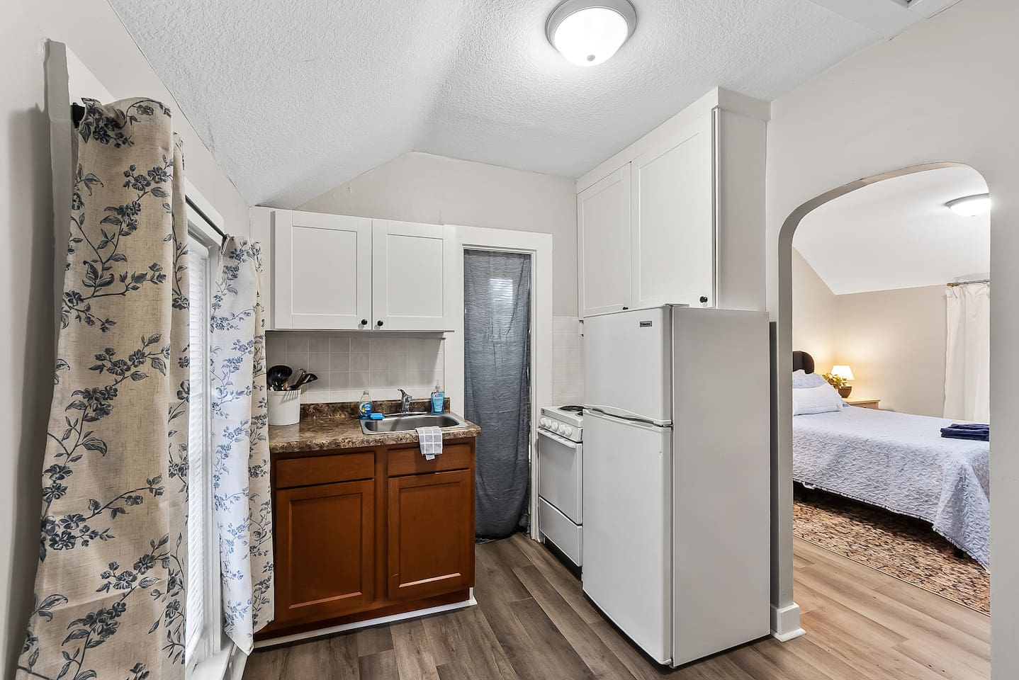 Thoughtfully laid out for easy stays, with the kitchenette just steps from the bedroom.