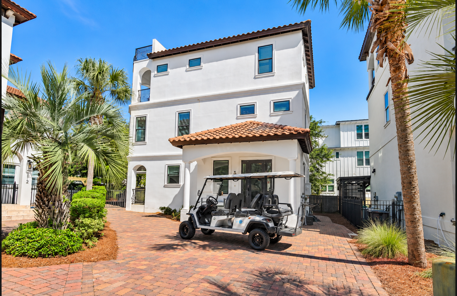 Beautiful Mediterranean-inspired architecture, palm-lined surroundings, and your own golf cart await.