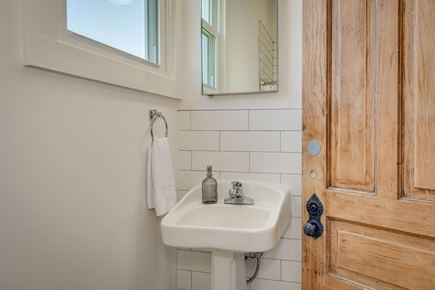 Modern bathroom with bright vanity and clean design.
