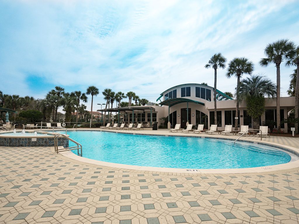 Club House Pool with loungers, tables, and plenty of seating