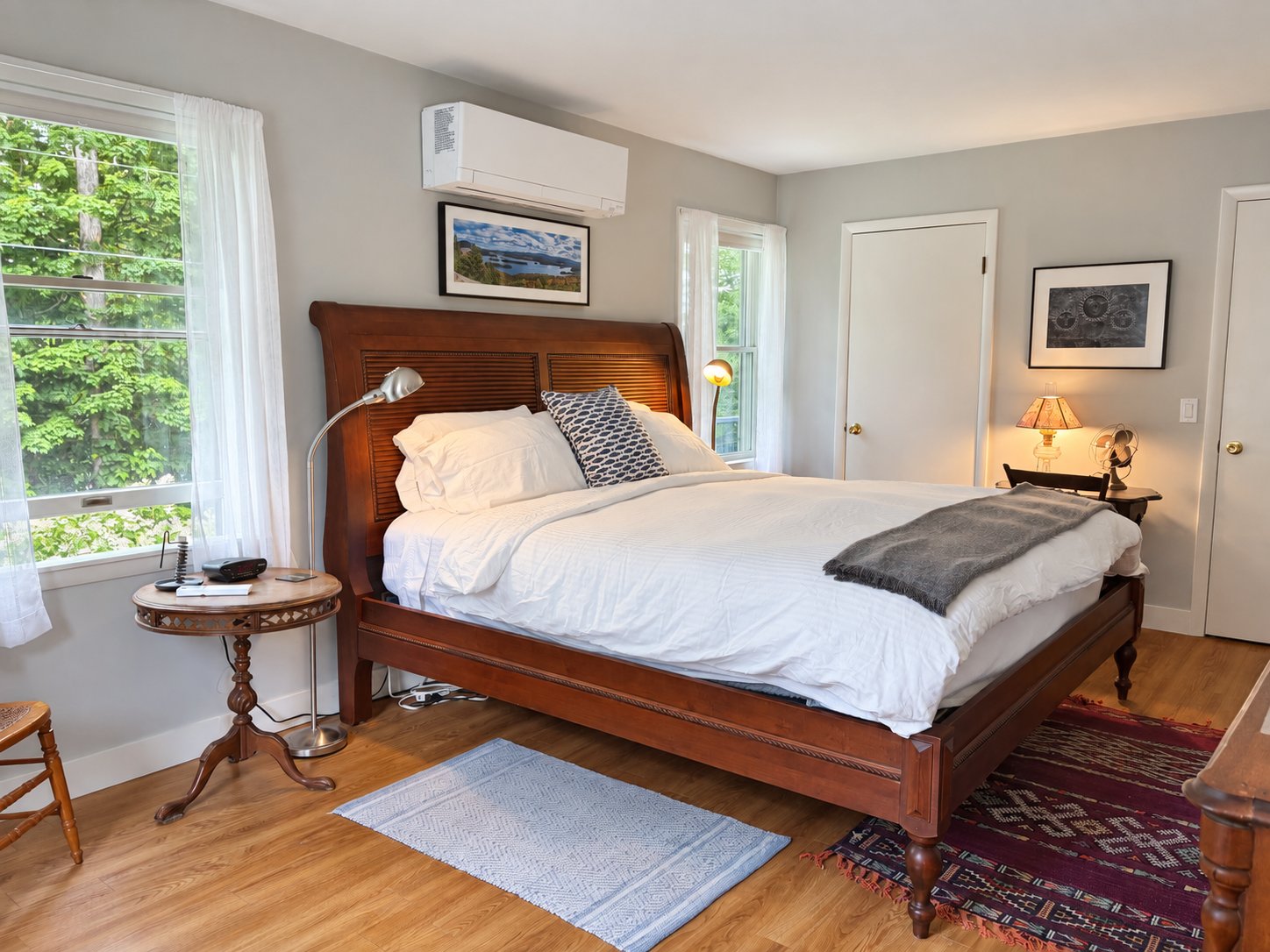 King bed with an adjoining half bath.