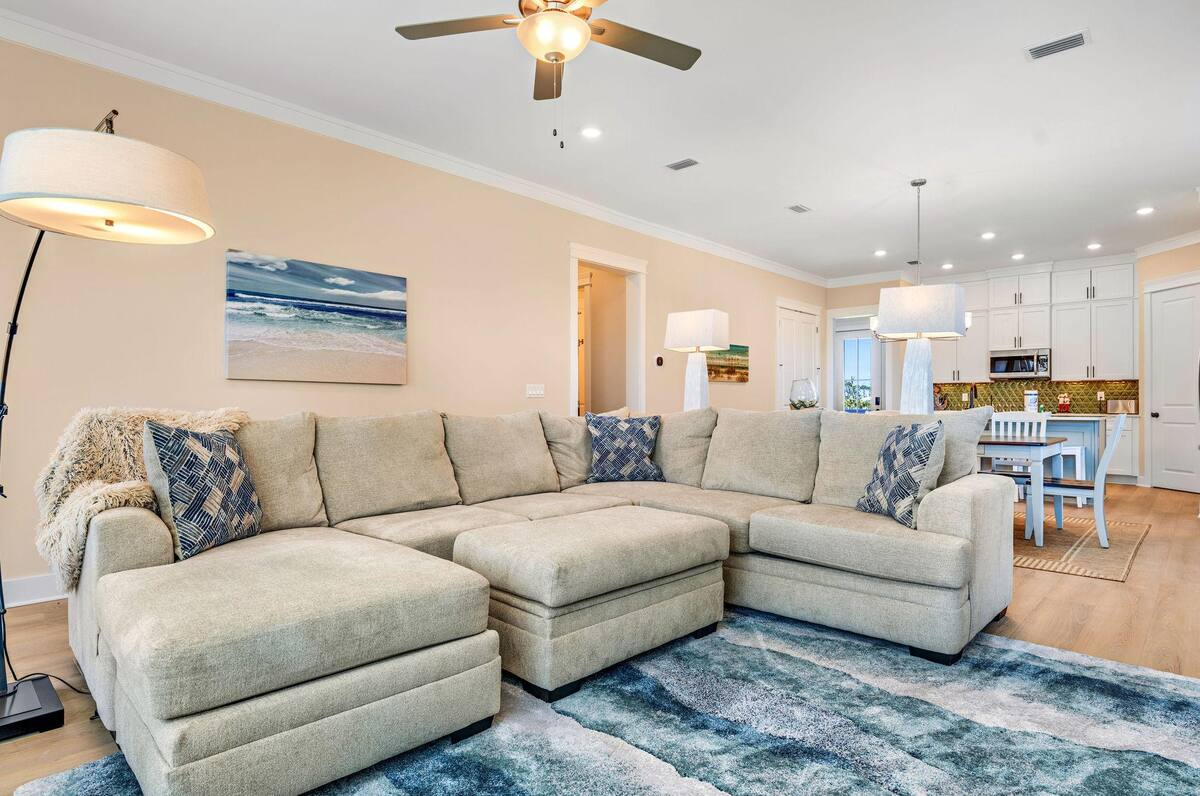 Bathe in natural light beneath soaring ceilings, surrounded by luxury finishes that elevate every moment of your stay.