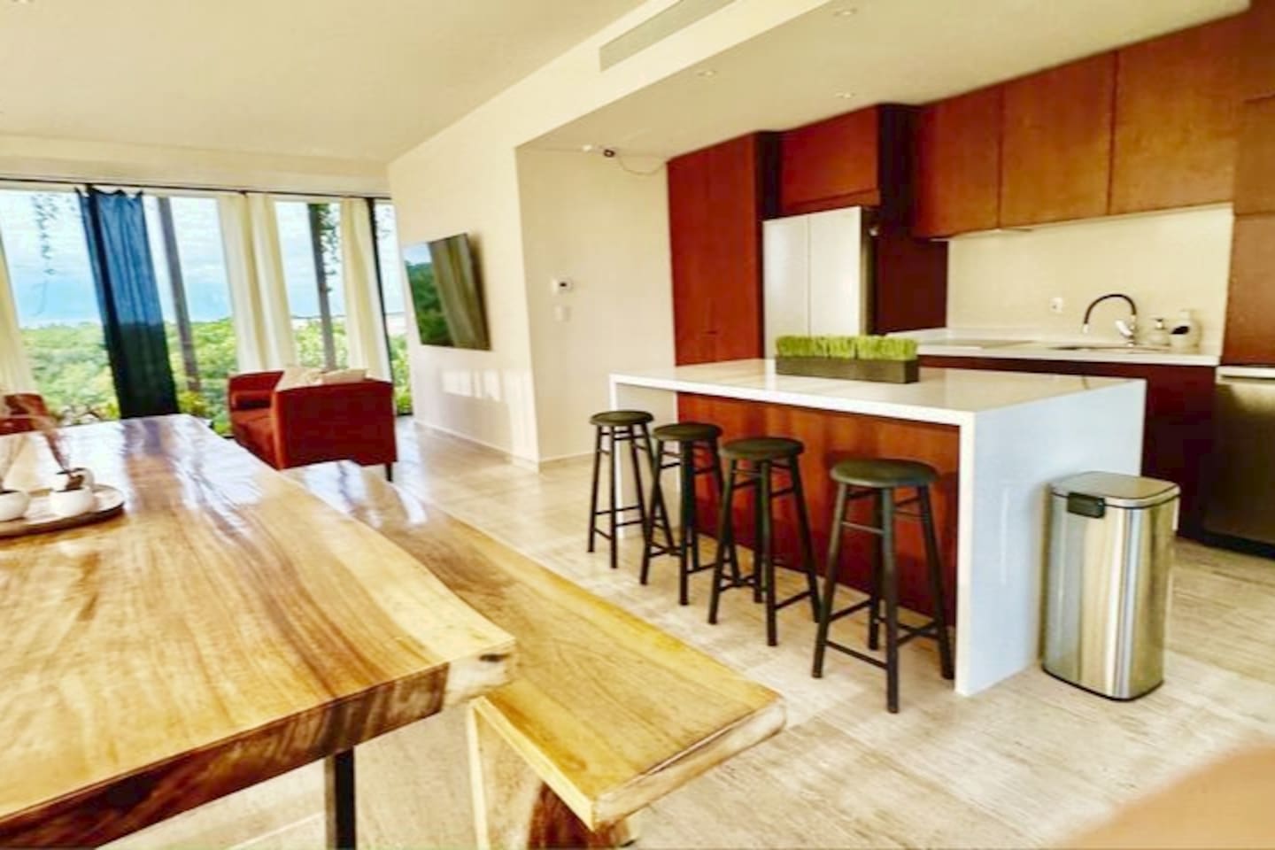 Dinning area has a large 3 meter table with two benches. Perfect for meals, working and hanging out.