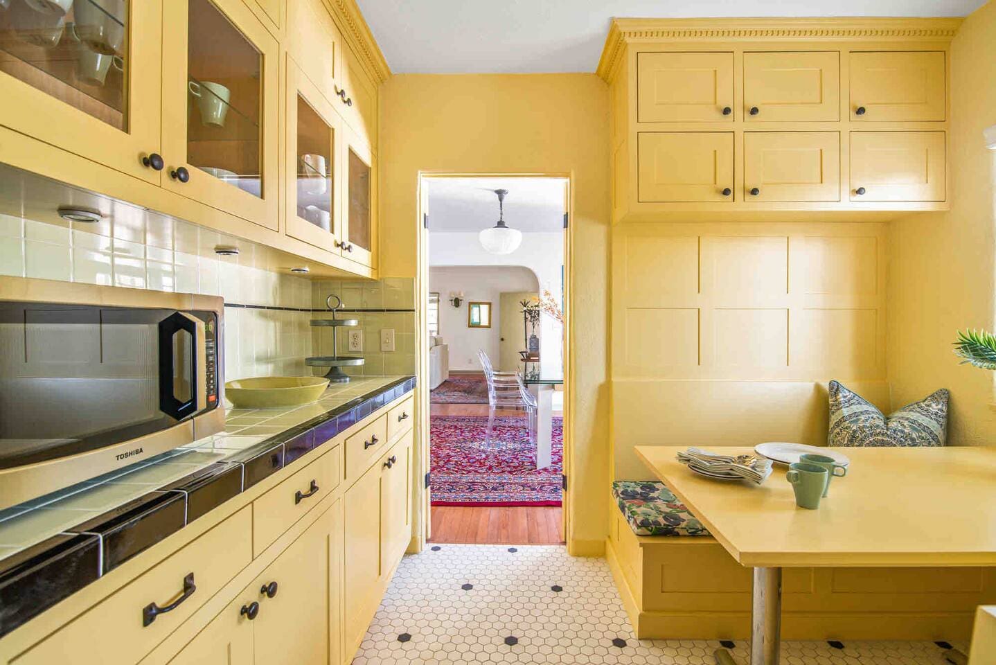 This kitchen was recently renovated with the original style of the house in mind. The cabinets are solid wood with soft-close drawers and plenty of storage. 