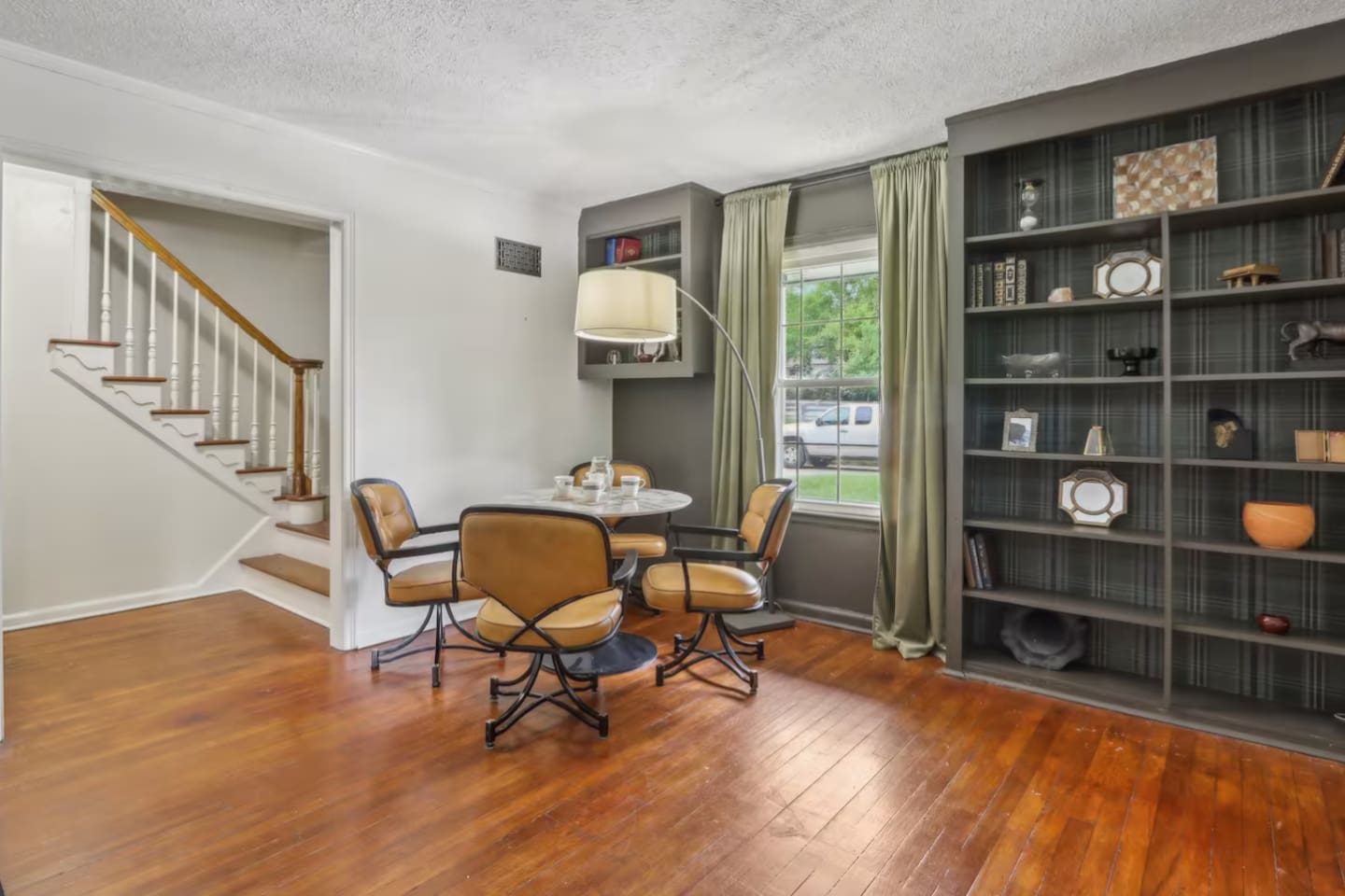 Enjoy a relaxed game night or casual conversation in this cozy sitting area, framed by built-in shelving.
