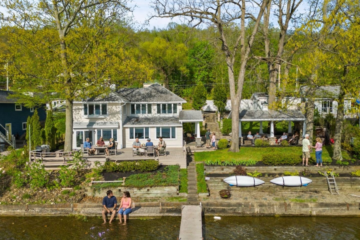 Charming lakeside home with a private dock, spacious deck, and kayaks ready for adventure. Surrounded by lush greenery, this retreat offers perfect opportunities for water activities and outdoor relaxation.