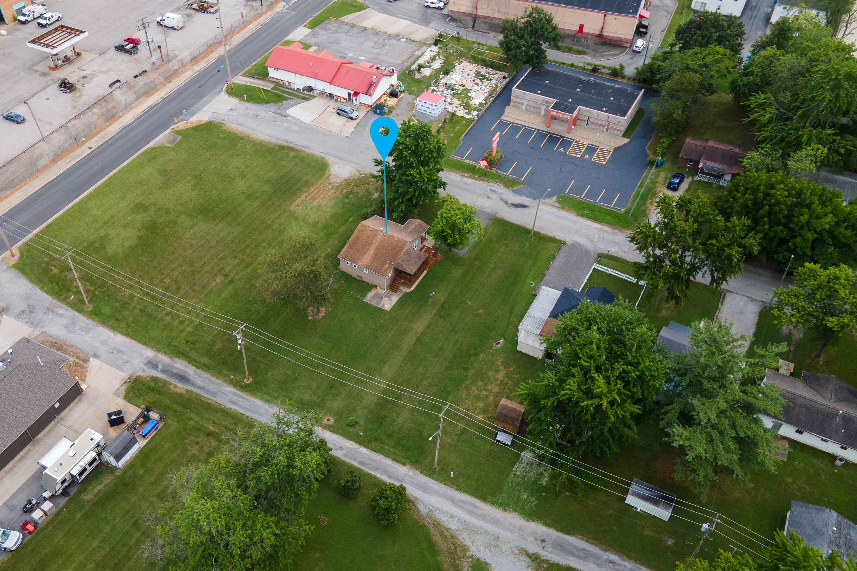 Room to relax, close to everything. Aerial views show a comfortable distance from neighbors, with the heart of town just minutes away.