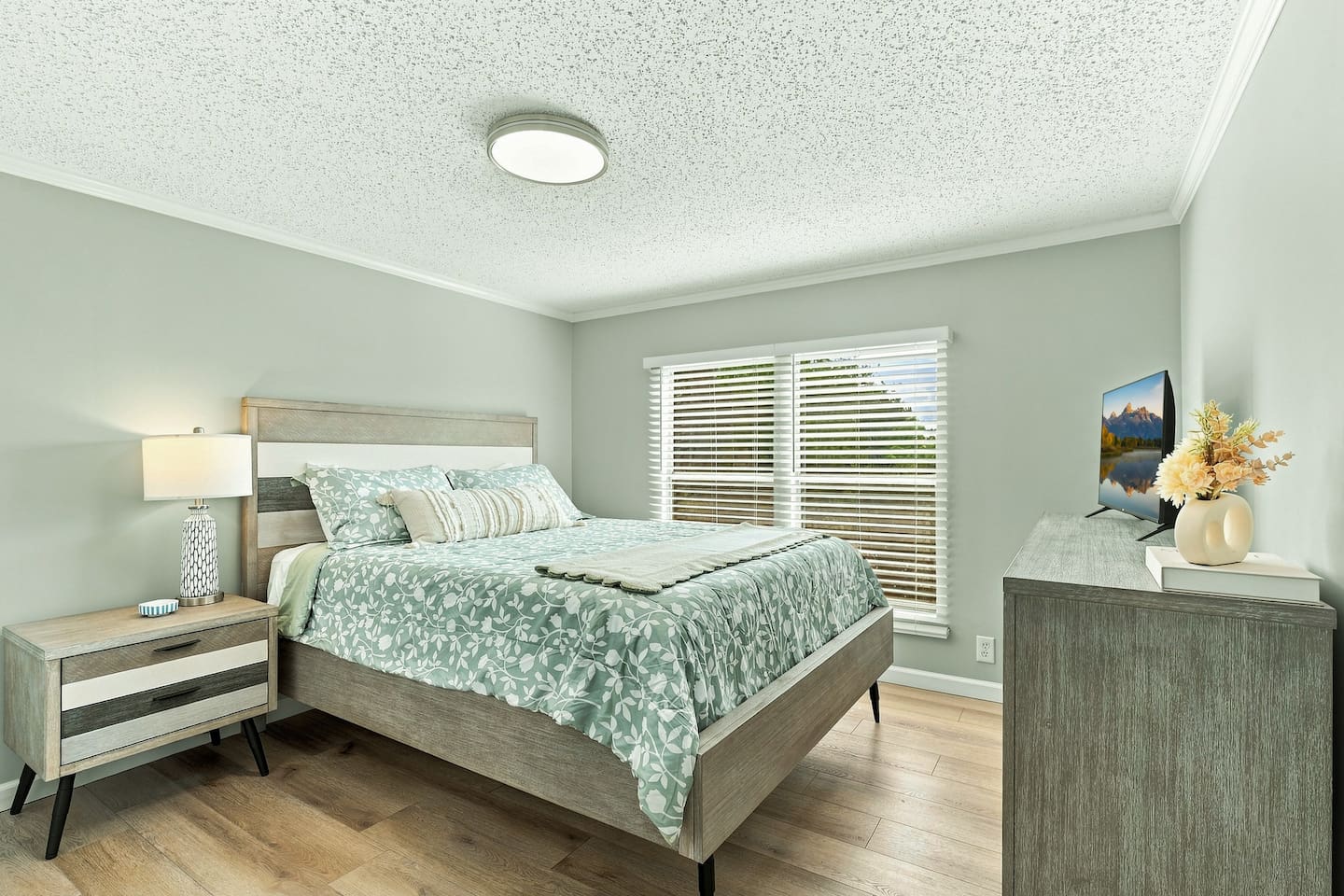 Settle into a comfortable queen bedroom with plenty of natural light, plus your own TV, dresser, and closet for an easy, comfortable stay.