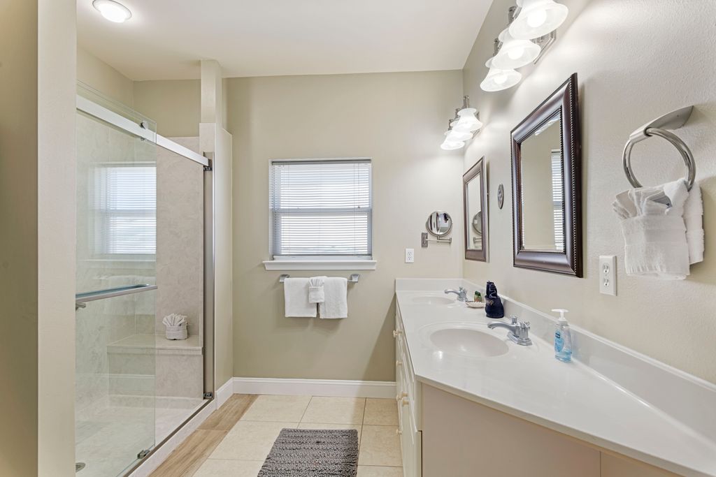 Third Floor: Bathroom 5
Bathroom 5 – Newly renovated en-suite full bathroom with walk-in shower and dual vanity mirrors.