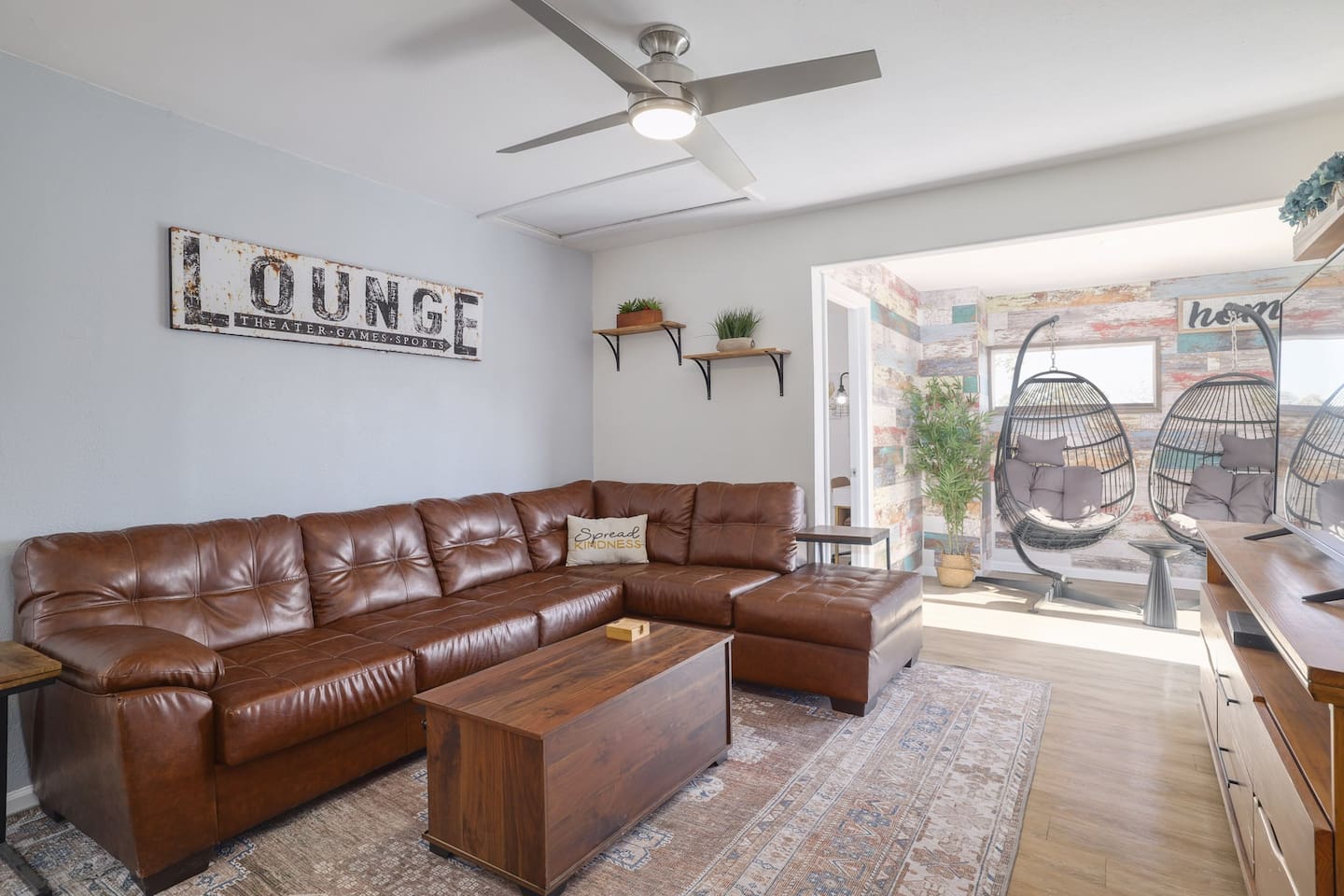 Stretch out on the oversized leather sectional, stream a movie, or drift into a quiet moment in the sunlit hanging chairs nearby. Warm textures and cozy gathering spaces make it easy to feel instantly at home.
