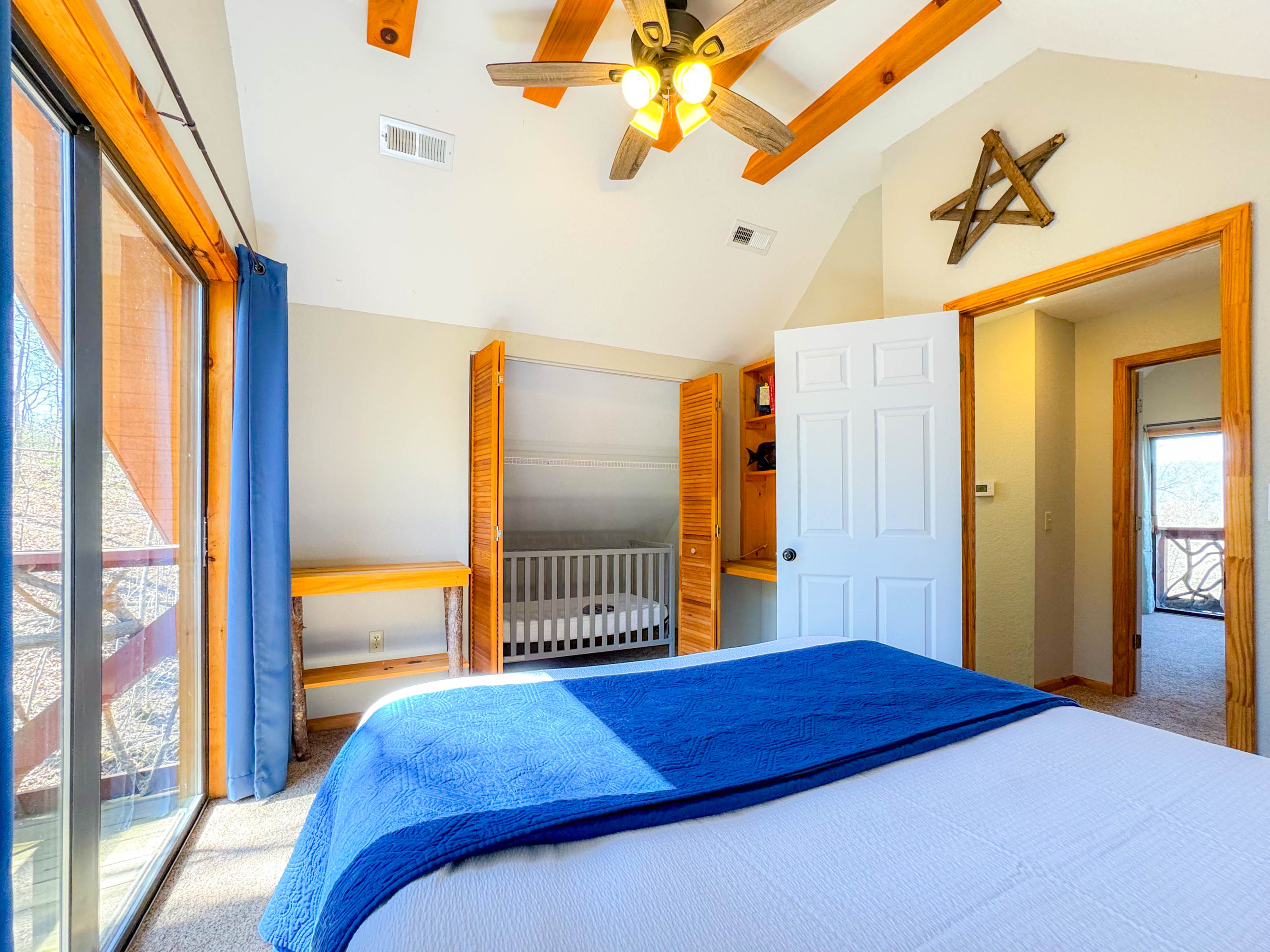 The upper level loft bedroom features a crib just inside the closet.