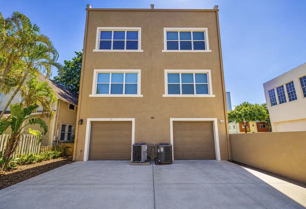 Modern exterior with a clean, updated look and private garage parking. Conveniently located in a quiet area just minutes from downtown, offering both comfort and easy access to nearby attractions.