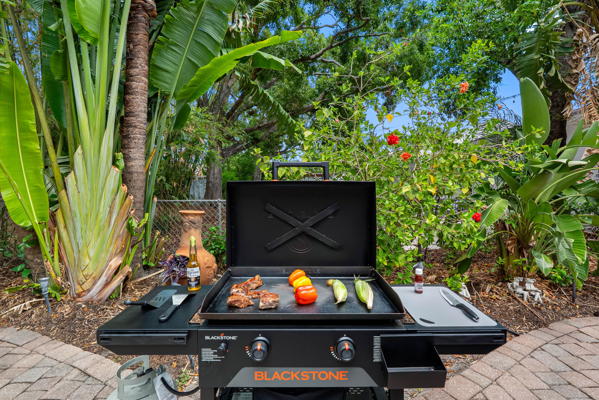 Grill, chill, and gather in this stylish outdoor space!