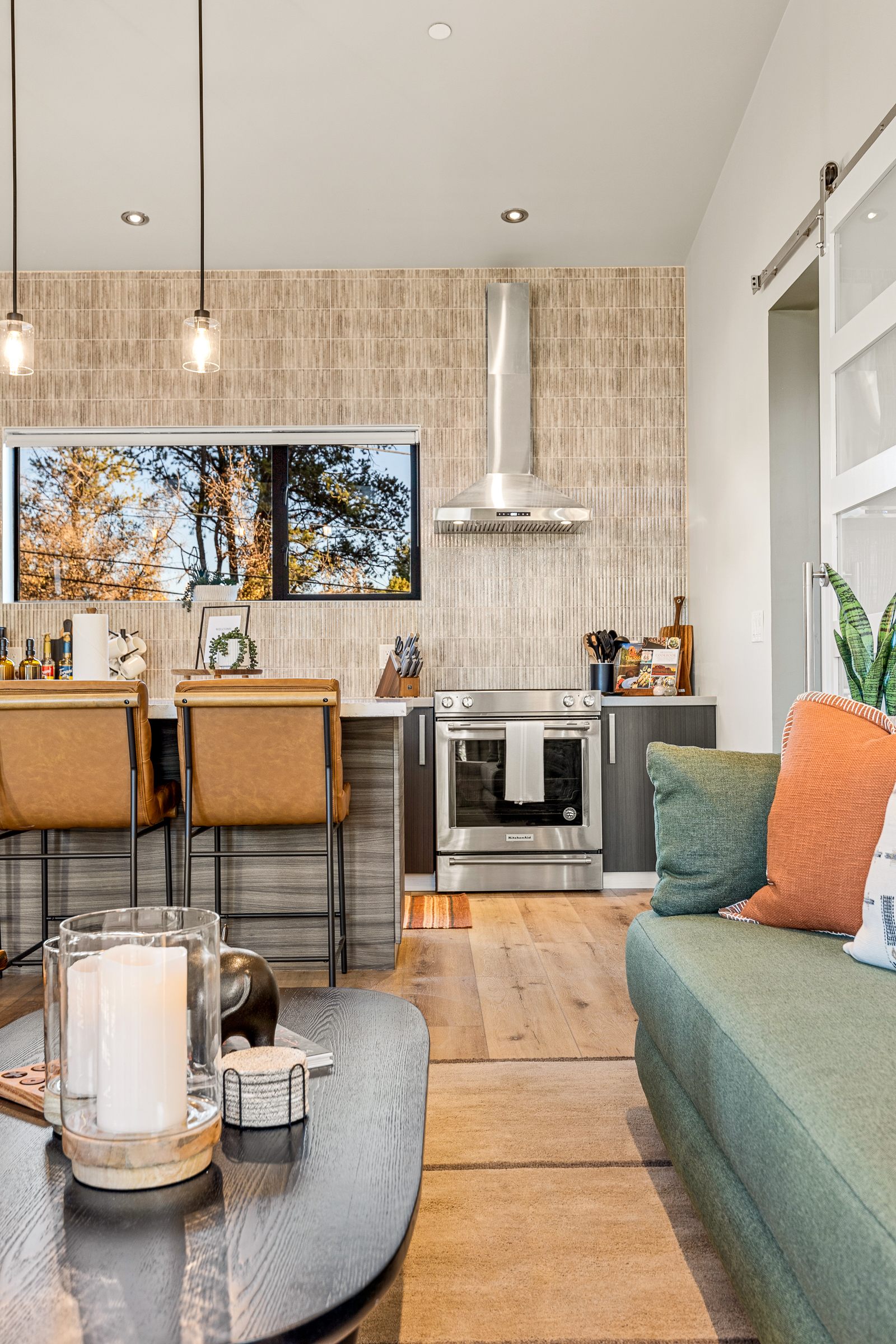 The living area flows easily into the kitchen, creating a relaxed space for cooking, conversation, and time together.