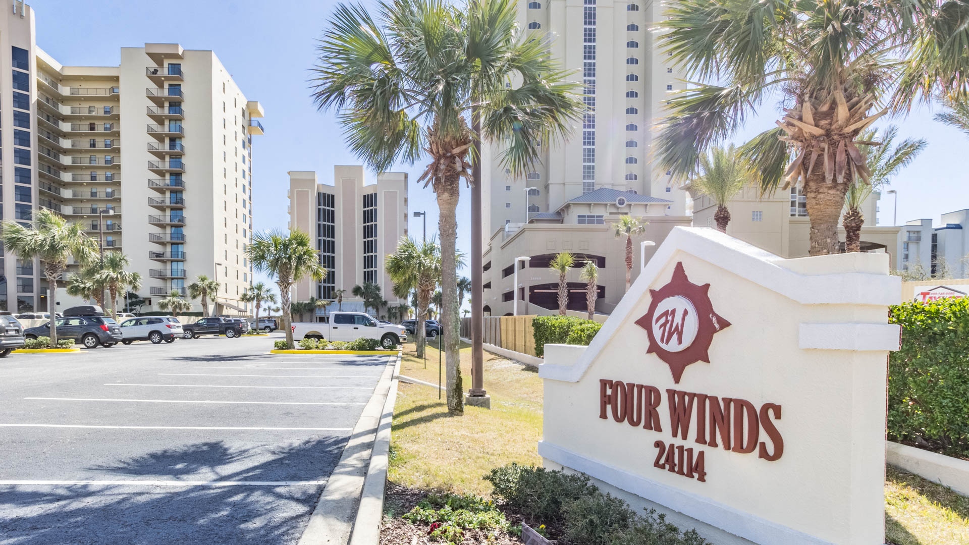 Soaring architecture against a backdrop of clear blue skies and swaying palm trees. Experience the allure of beachfront living.