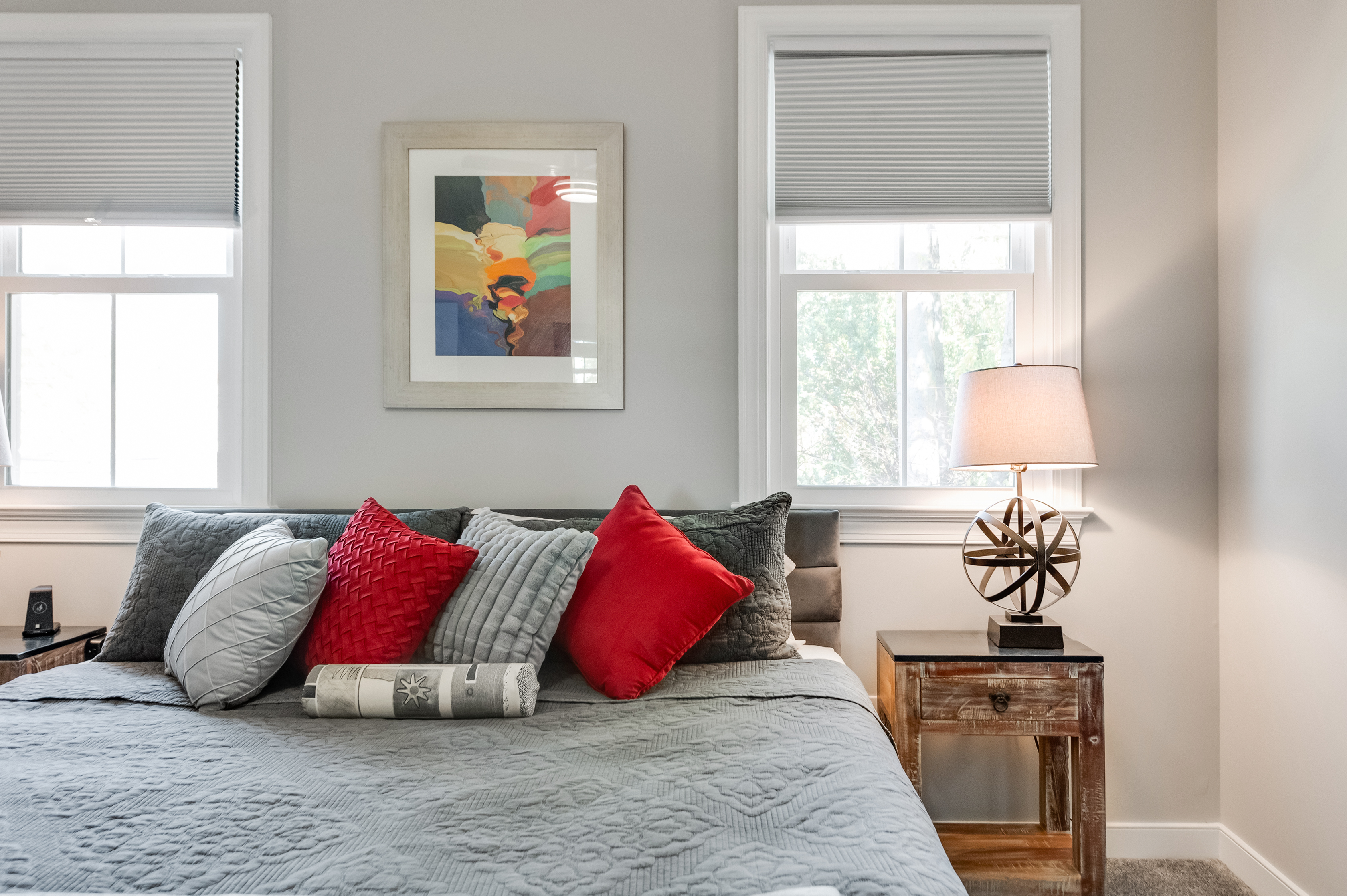 King Bedroom 1: Bright and inviting room with artistic decor and plush bedding!