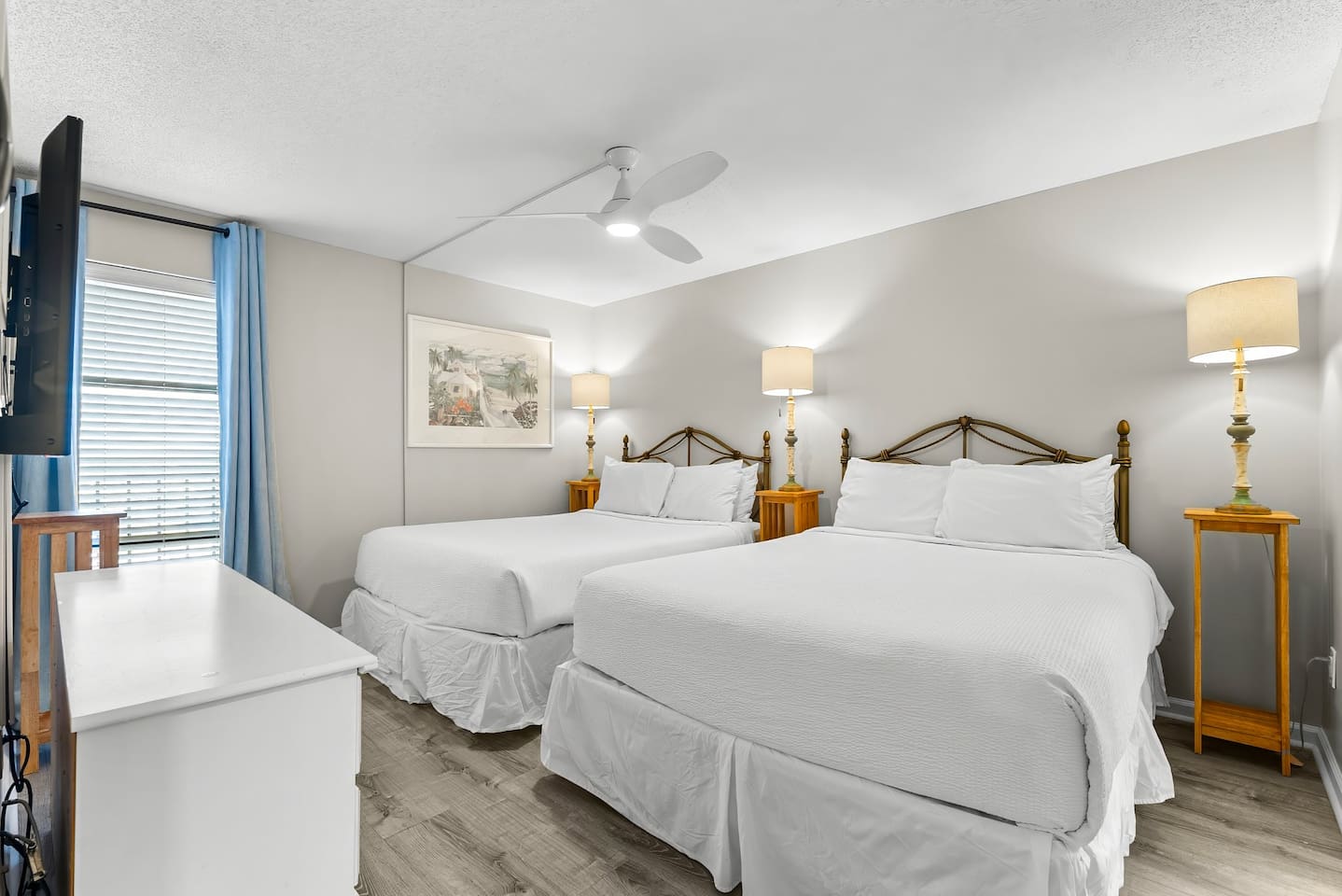 Guest bedroom with two queens, ceiling fan, smart TV