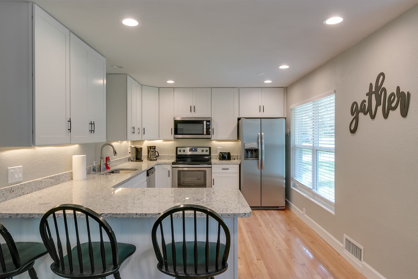 Remodeled kitchen with granite and stainless steel appliances