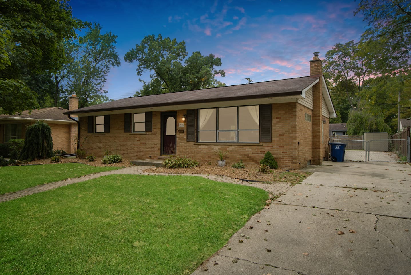 The charming family getaway offers plenty of parking space.