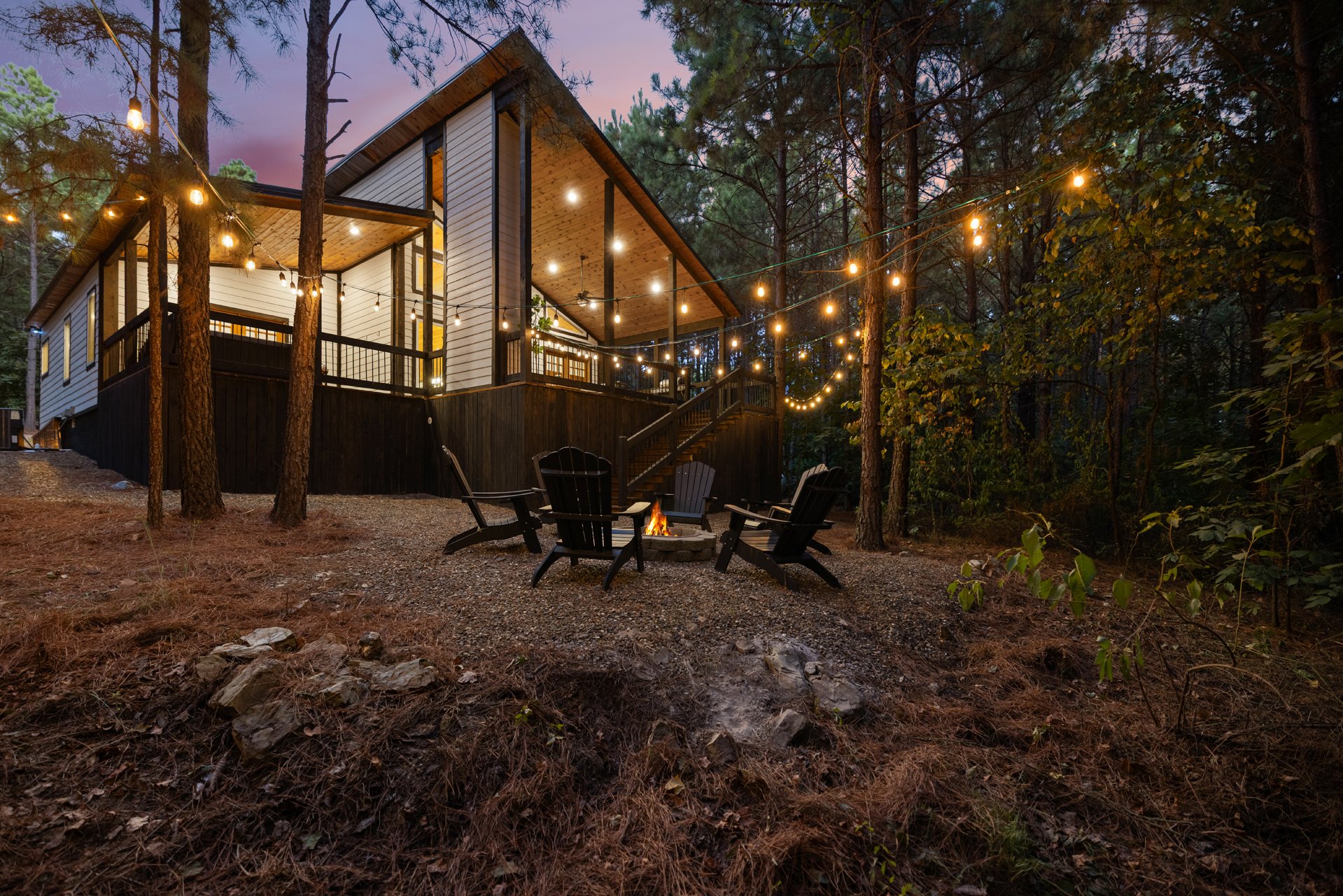 Tucked beneath the pines, Cedar Stillness is your own little forest escape, peaceful, private, and secluded, with glowing string lights and fireside nights waiting just outside.