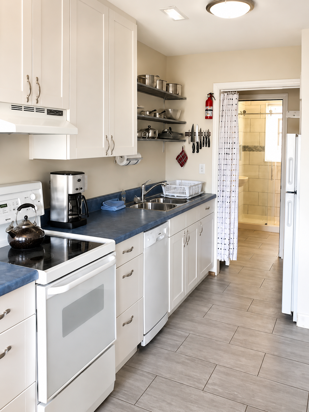 Bathroom and bedroom are just beyond the kitchen.   **Photo without wide lens provided for perspective**