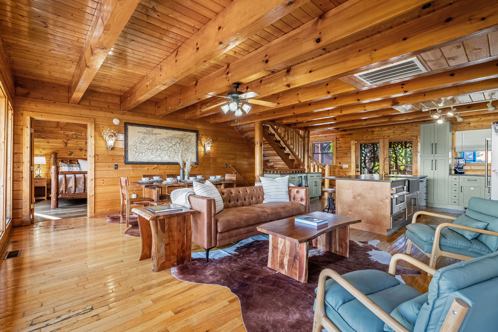This expansive gathering space features soaring cedar plank ceilings, floor-to-ceiling windows, and uninterrupted views of the Smoky Mountains.