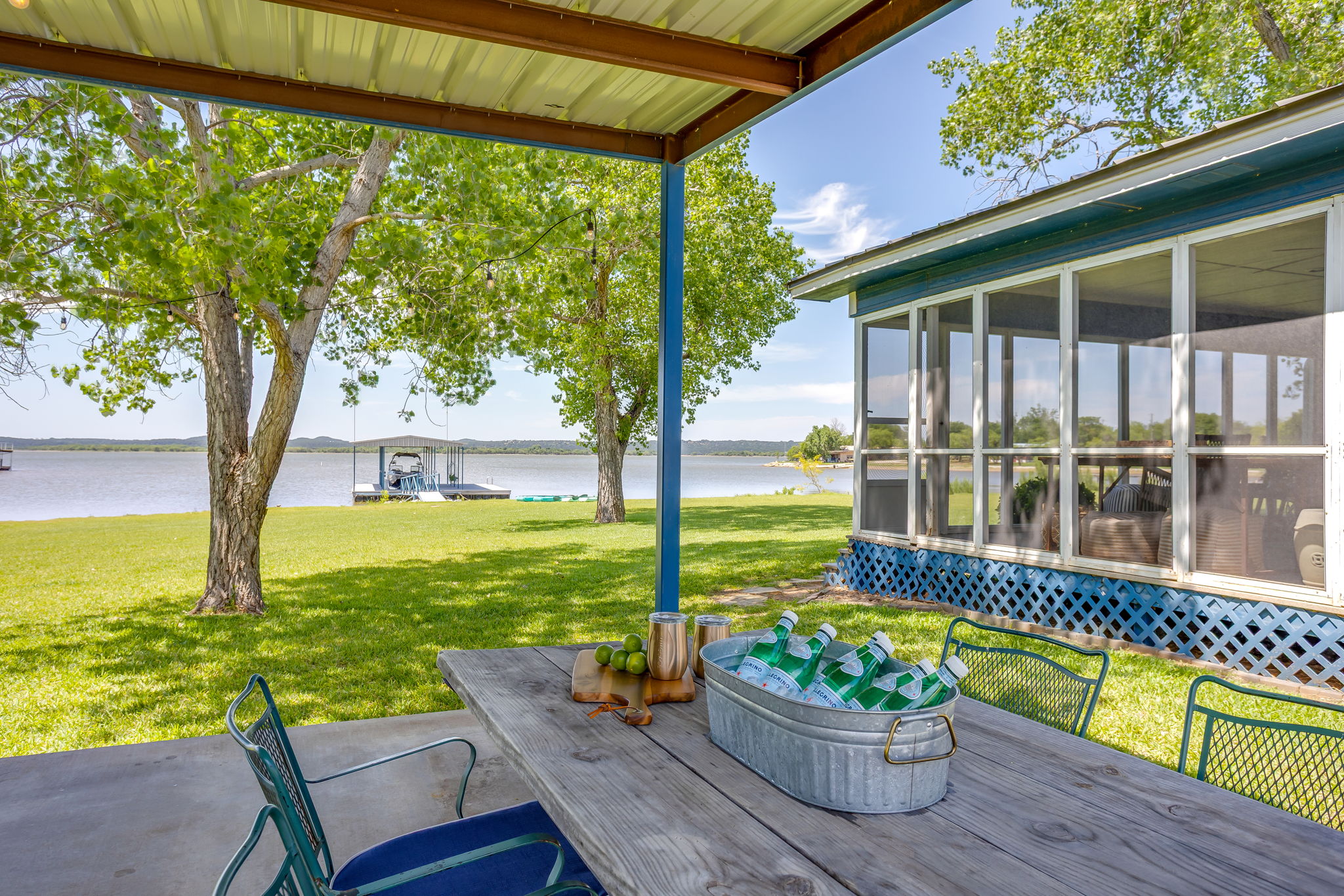 Outdoor covered patio with gas grill, charcoal grill and lots of seating