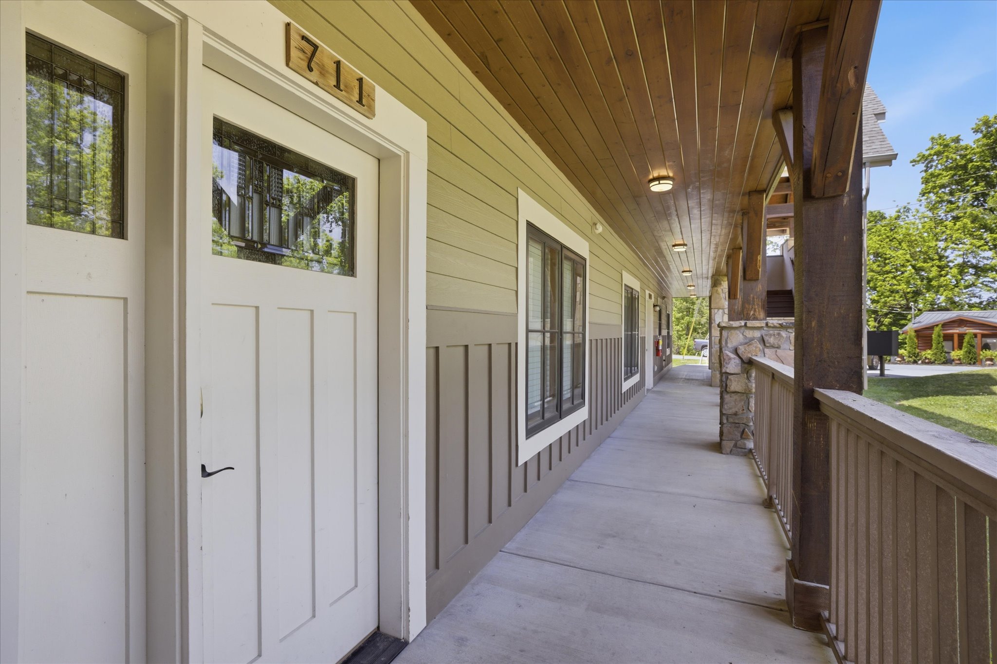 Arrive with ease at the private entry to Hearthstone Lodge's Unit 711, where step-free access and nearby parking make settling in simple from the moment you pull up.