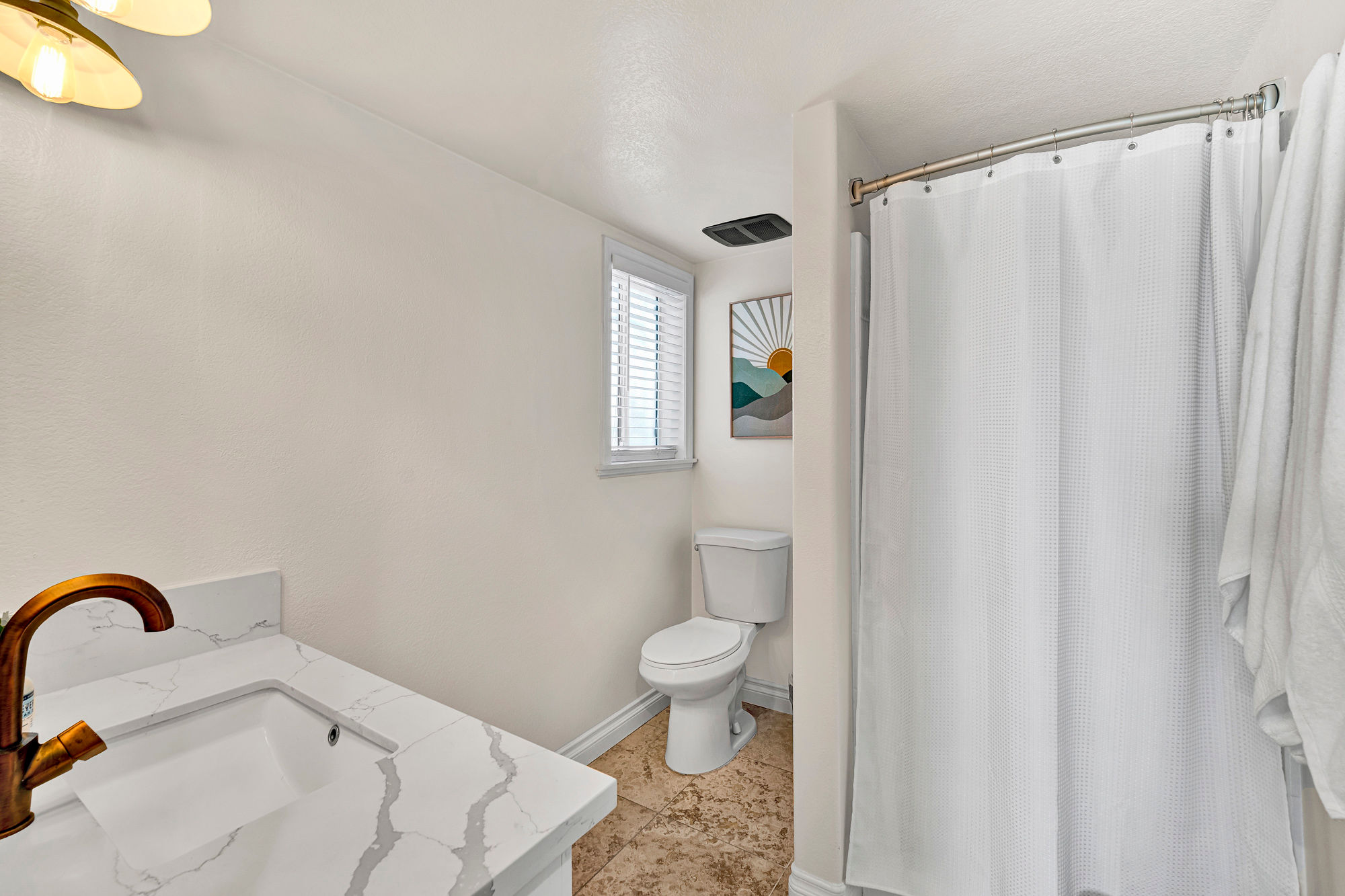 Spacious guest bathrooms stocked and ready — comfort and convenience for every guest