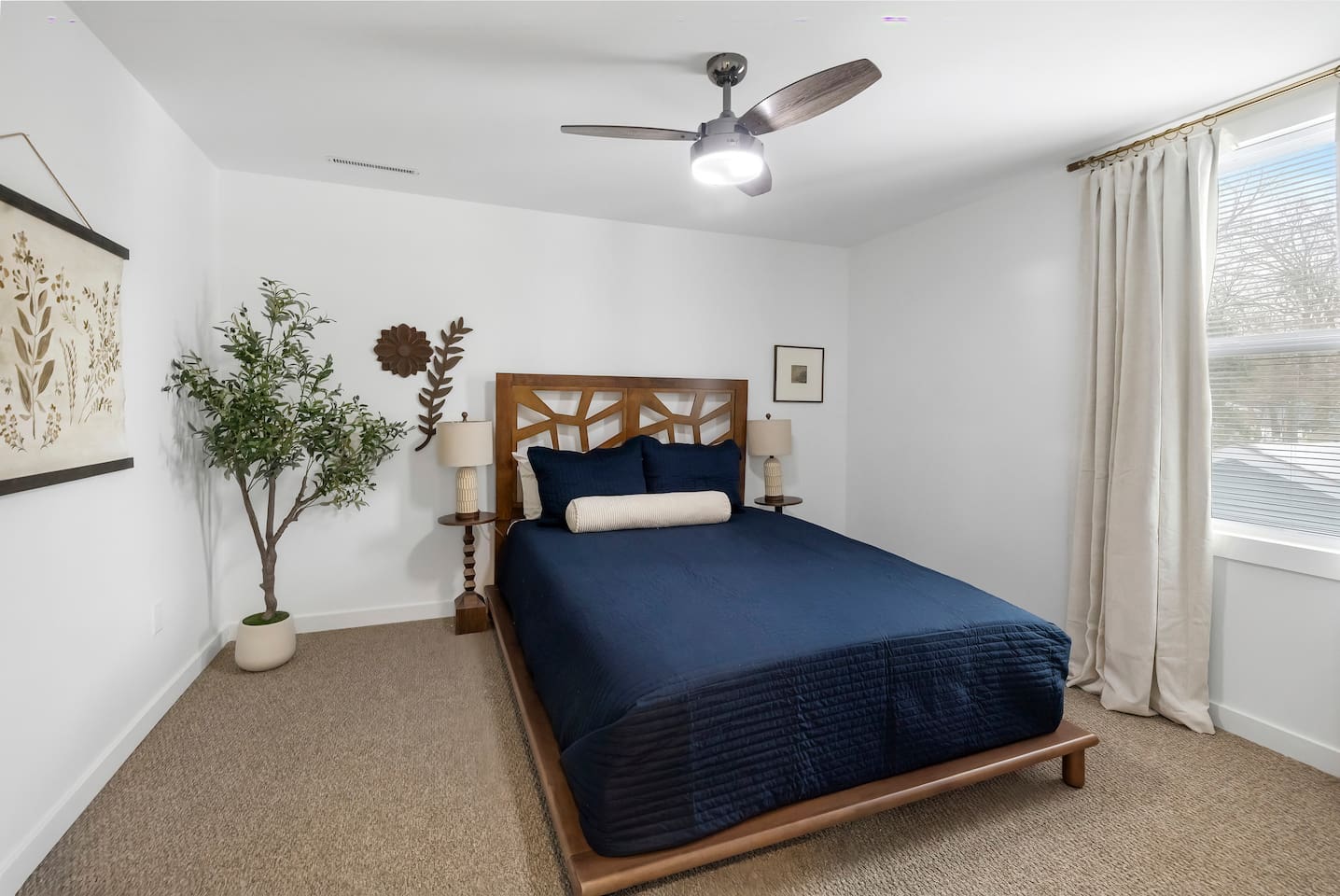 Queen-sized bed in one of the upstairs bedrooms. 