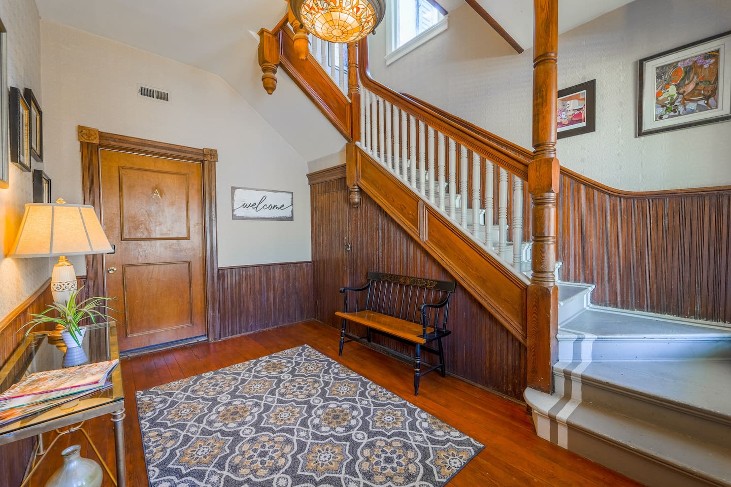 Enjoy the beautiful entrance with its original hardwood and artwork.