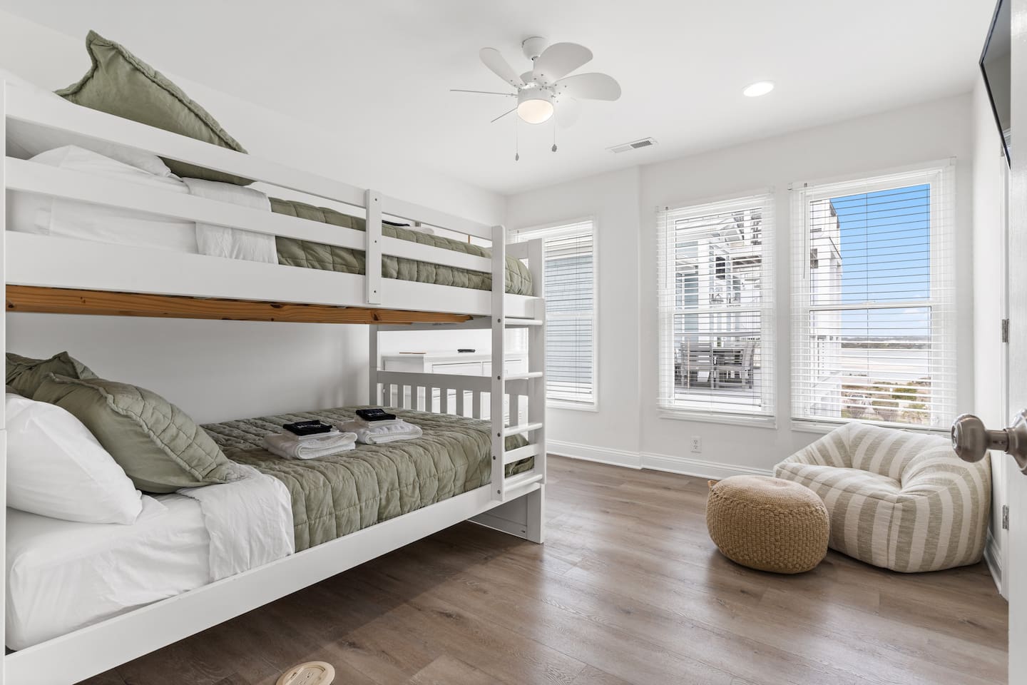 Second Floor - Full Over Full Bunk Room, Smart TV, Lounge Chair, Dresser & Closet for Storage.