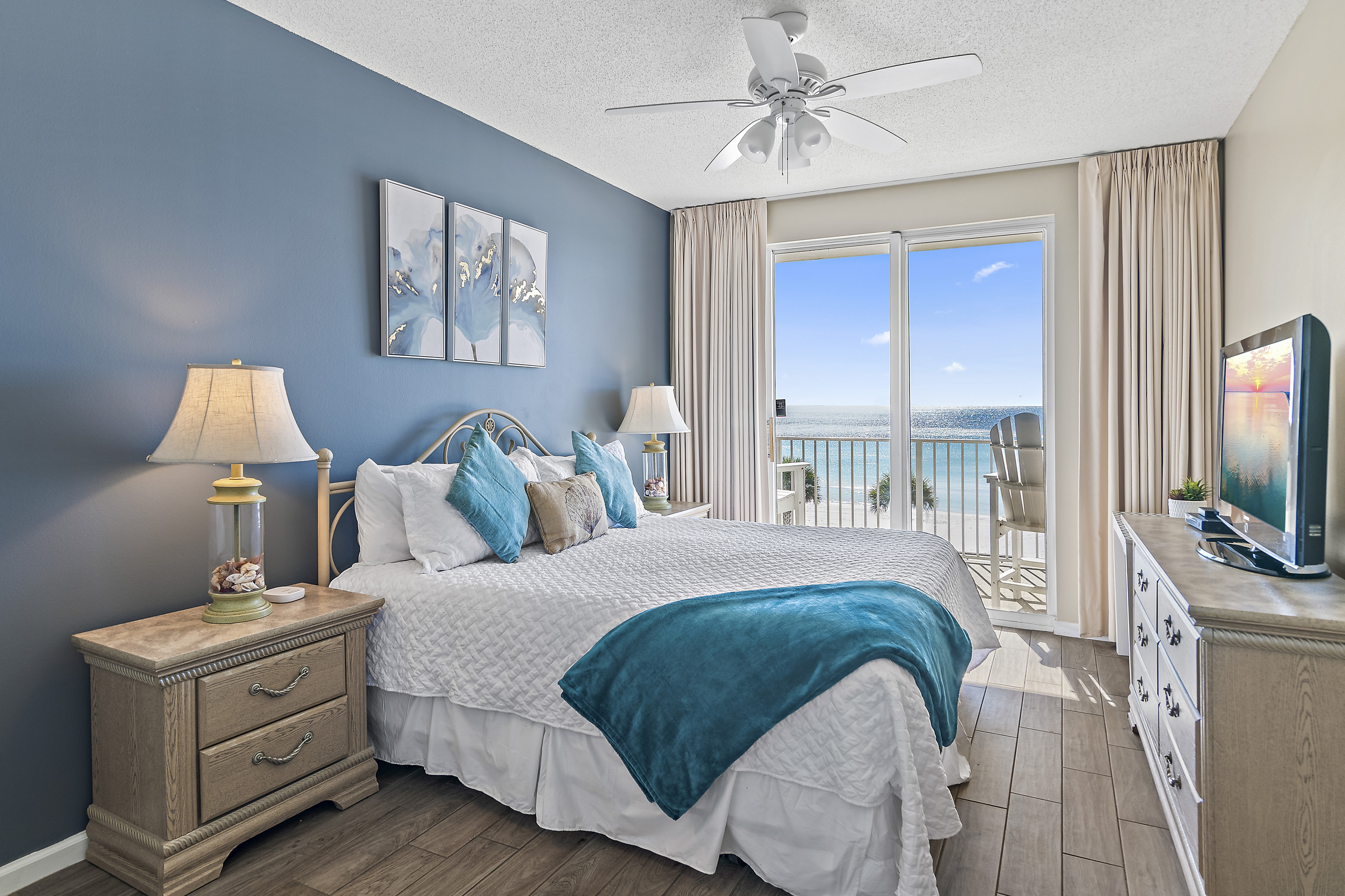Spacious master bedroom is beautifully decorated and features a King bed, Gulf views, Desk and Chair, balcony access, SMART TV w/ cable access, private bathroom, and large closet.