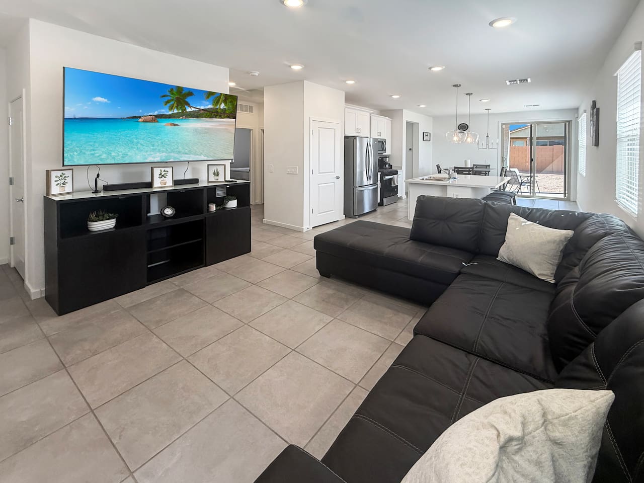 Living room with sectional sofa and wall-mounted TV
